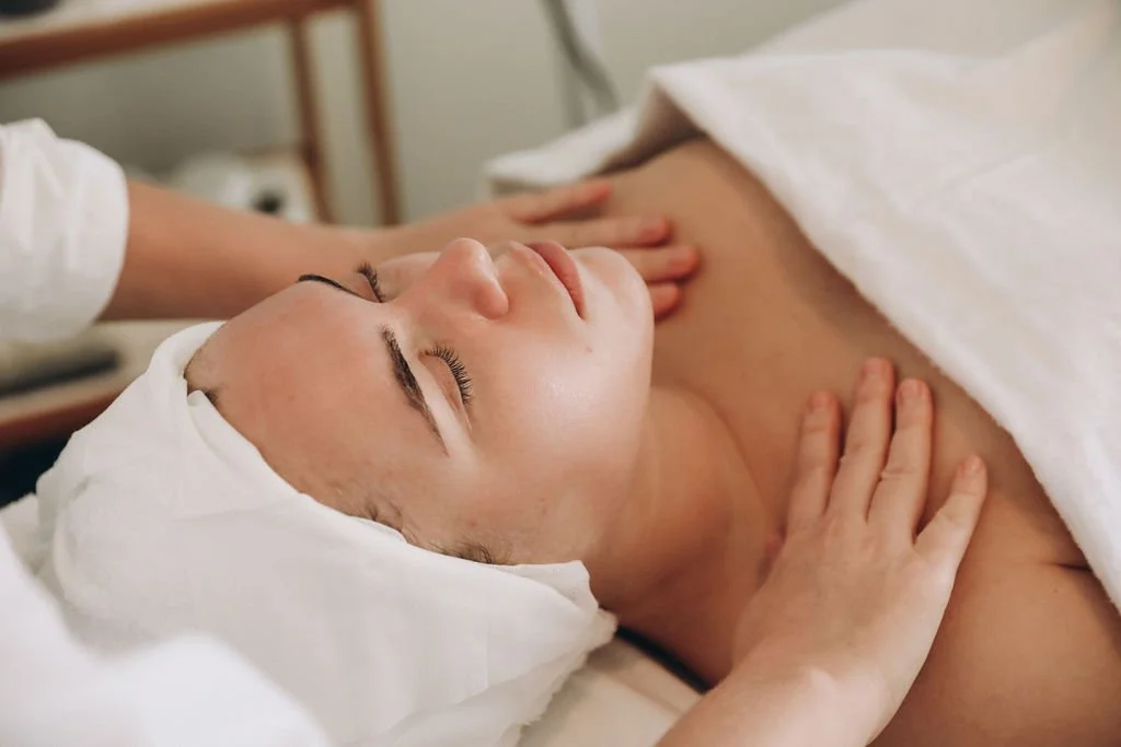 A relaxed woman is getting a massages.