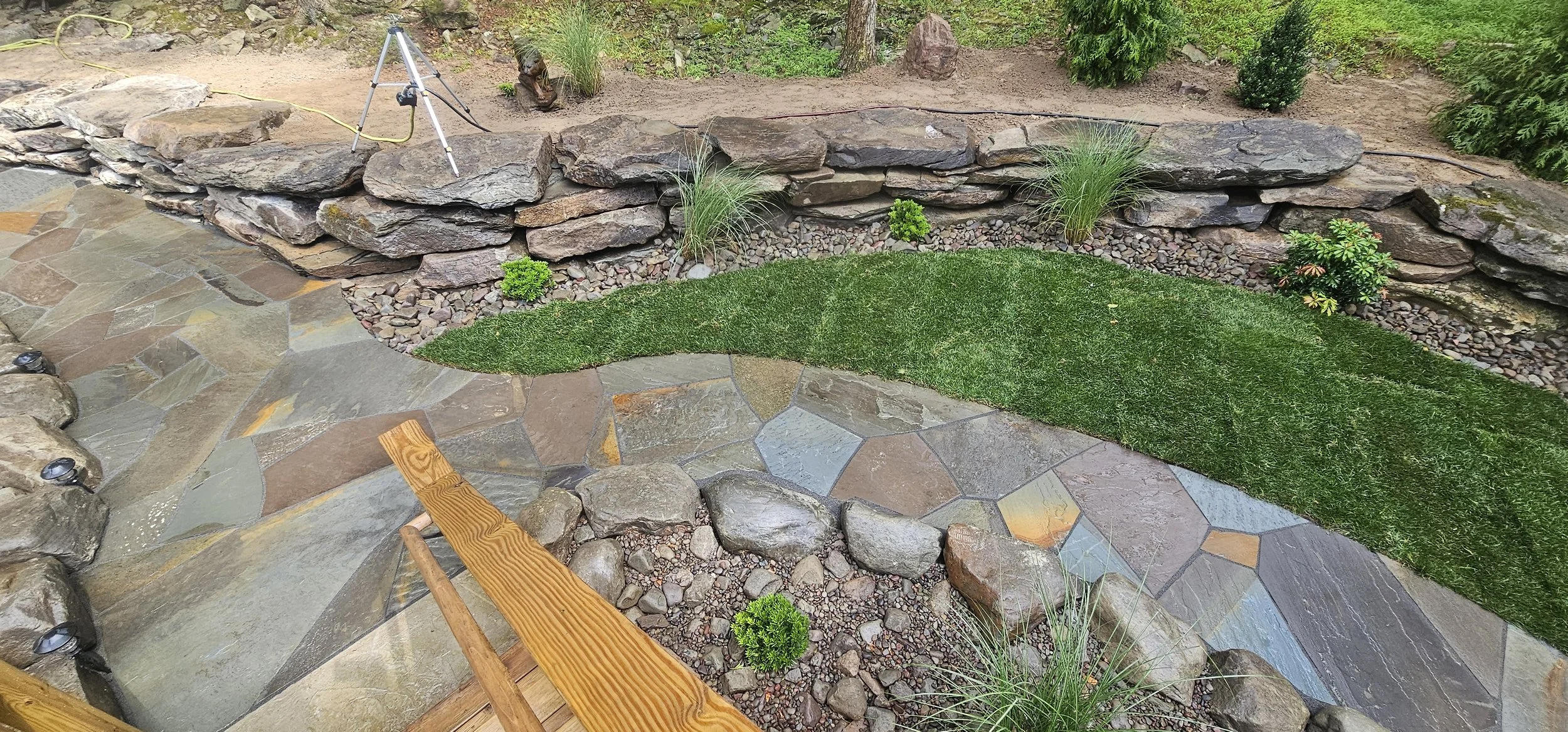 Scrolling walkway, with sod and boulder wall