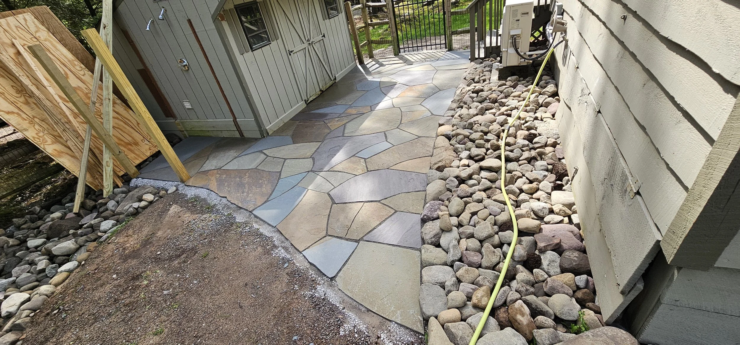 Shed access patio, with outdoor shower