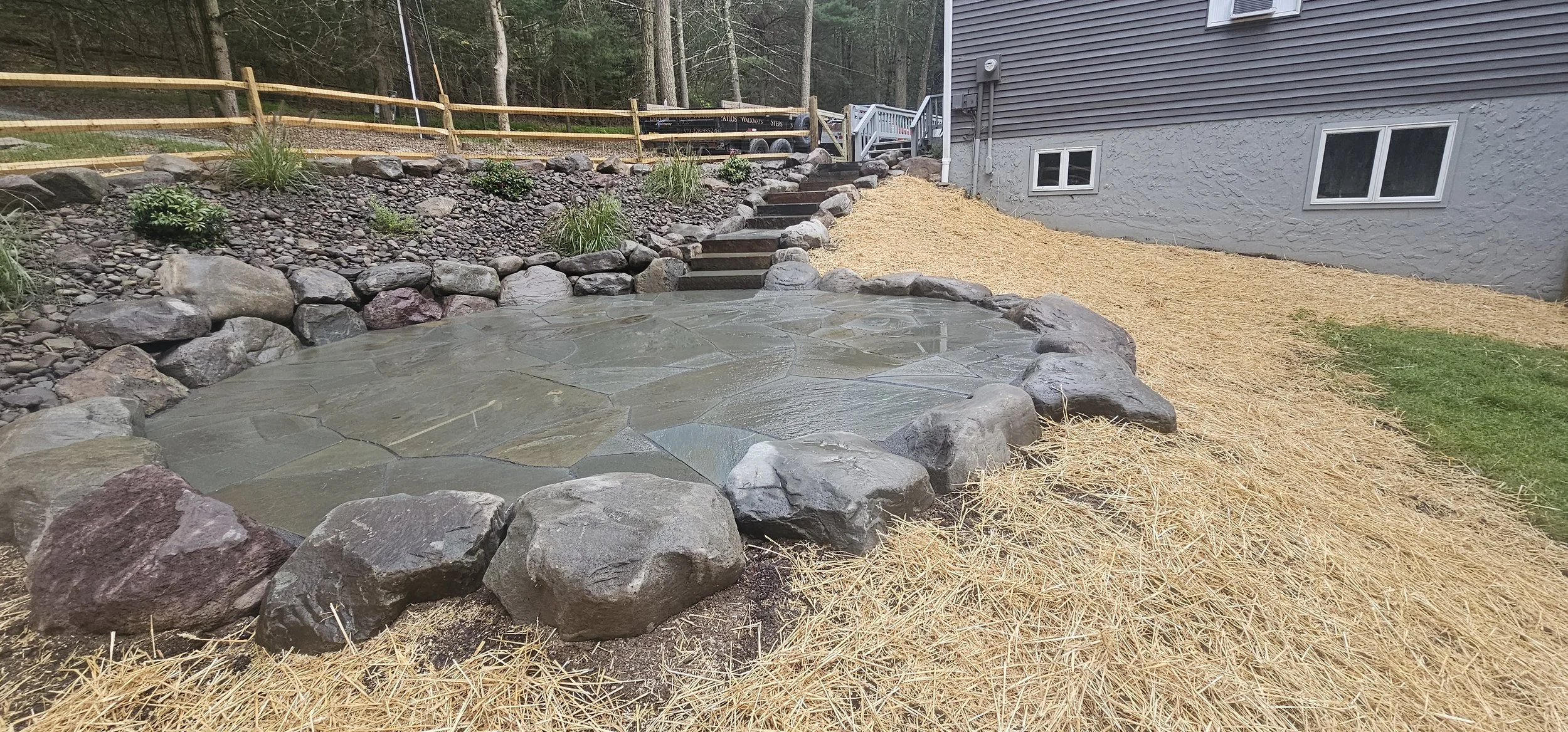 Steps leading down to a bluestone patio