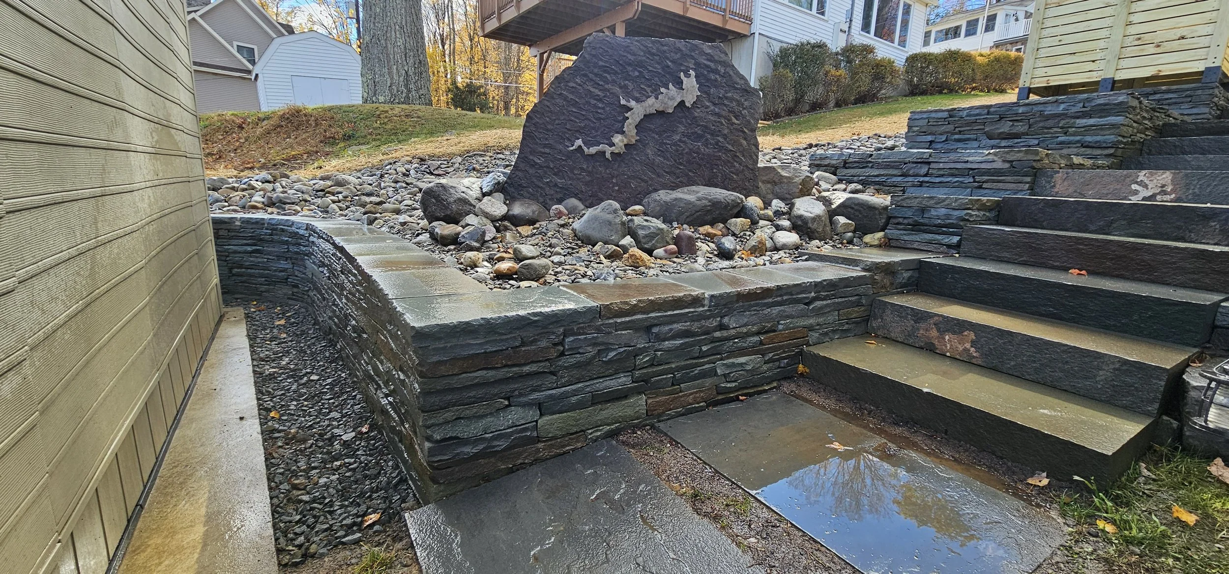 Multiple tiers of stacked bluestone , with a unique statement piece 