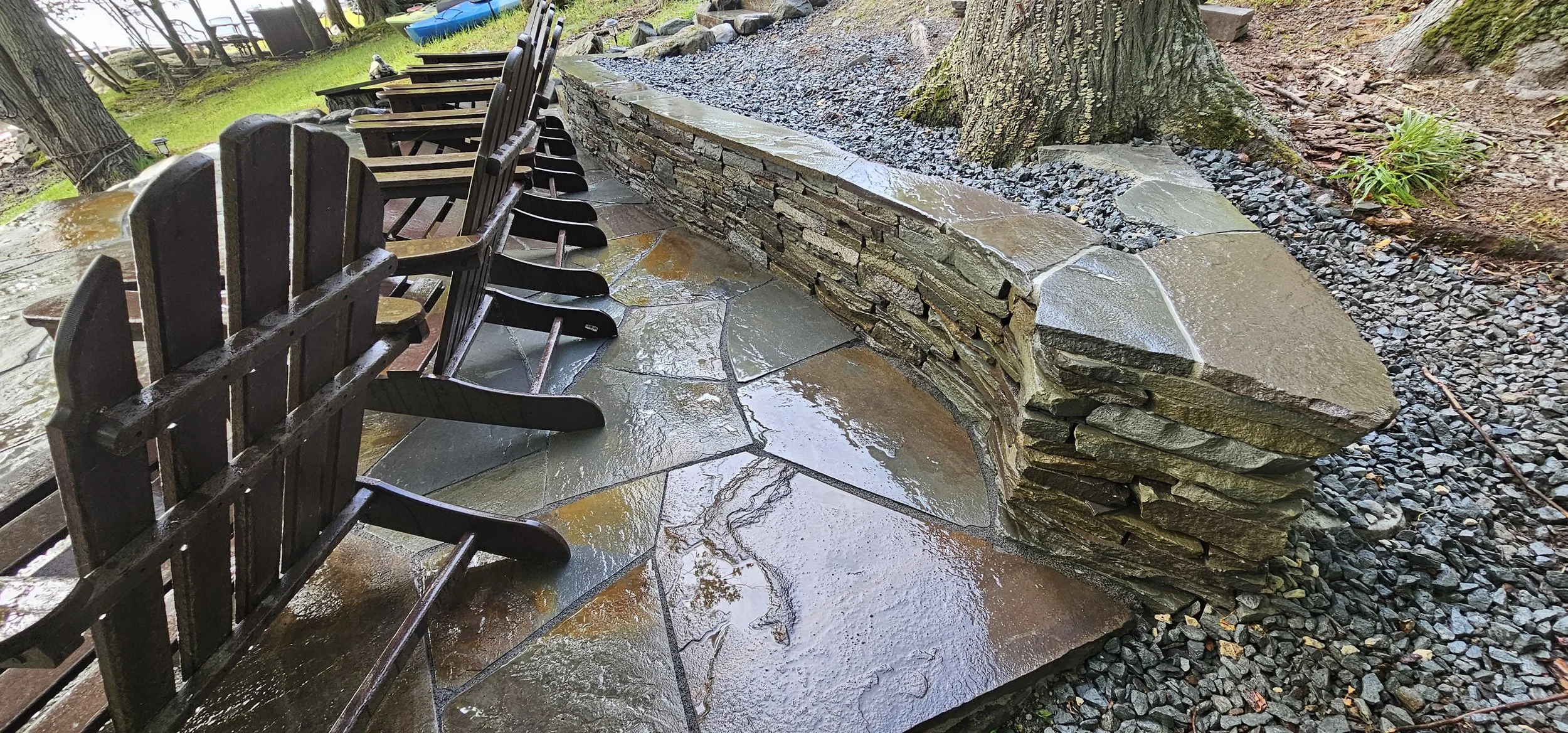 Bluestone patio, with stacked stone retaining wall