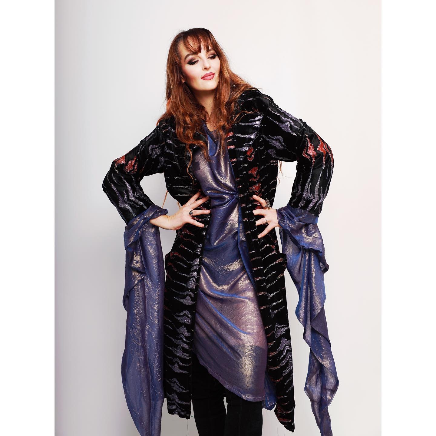 This Velvet Trench is very much unisex and fully made from deadstock so sustainable -
Paired here with our lilac shimmer pagan sleeve dress and long black sultry thigh boots
Photographer @als_25_photos
MUA - @jesty_quinn_clown
As seen in this