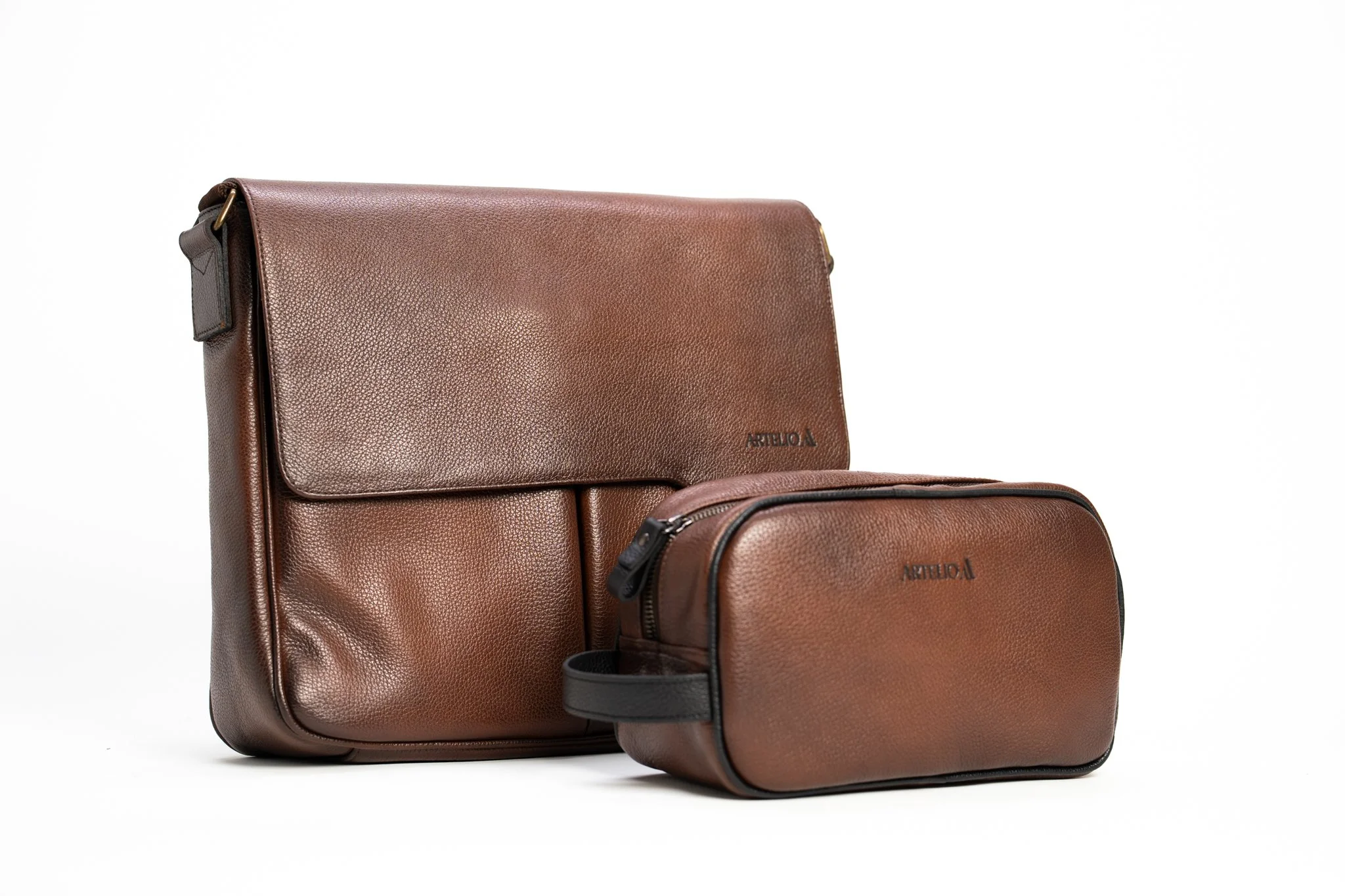Set of three brown leather bags of different sizes, including a large shoulder bag, a smaller crossbody bag, and a matching pouch, all with a smooth texture and gold hardware.