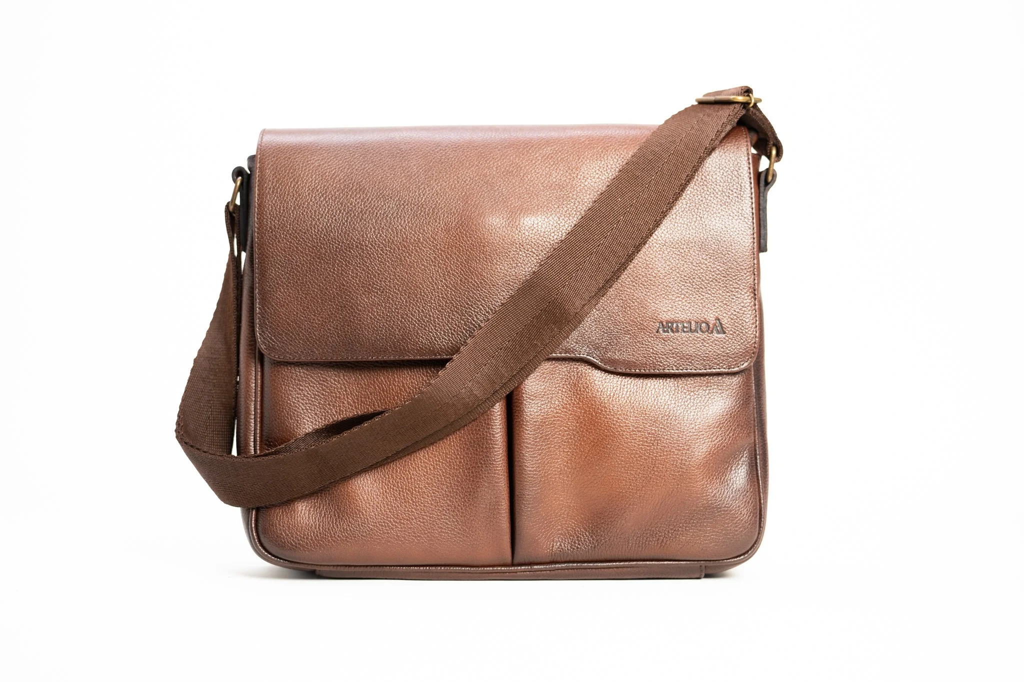 Brown leather shoulder bag with a dark brown strap, featuring a textured surface and a small logo that reads 'ARTELOA' on the front.