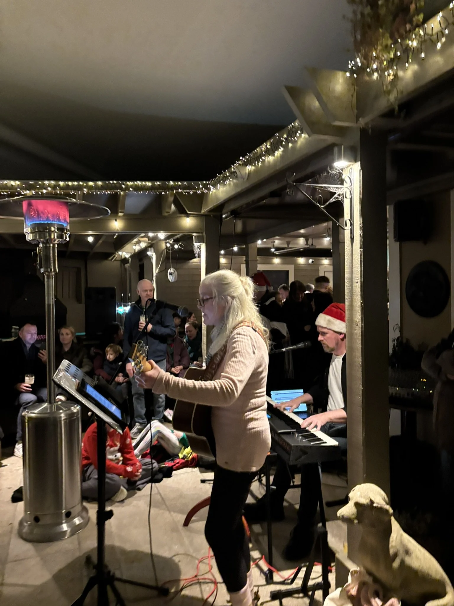 Rachel and the Musicians leading the Carols