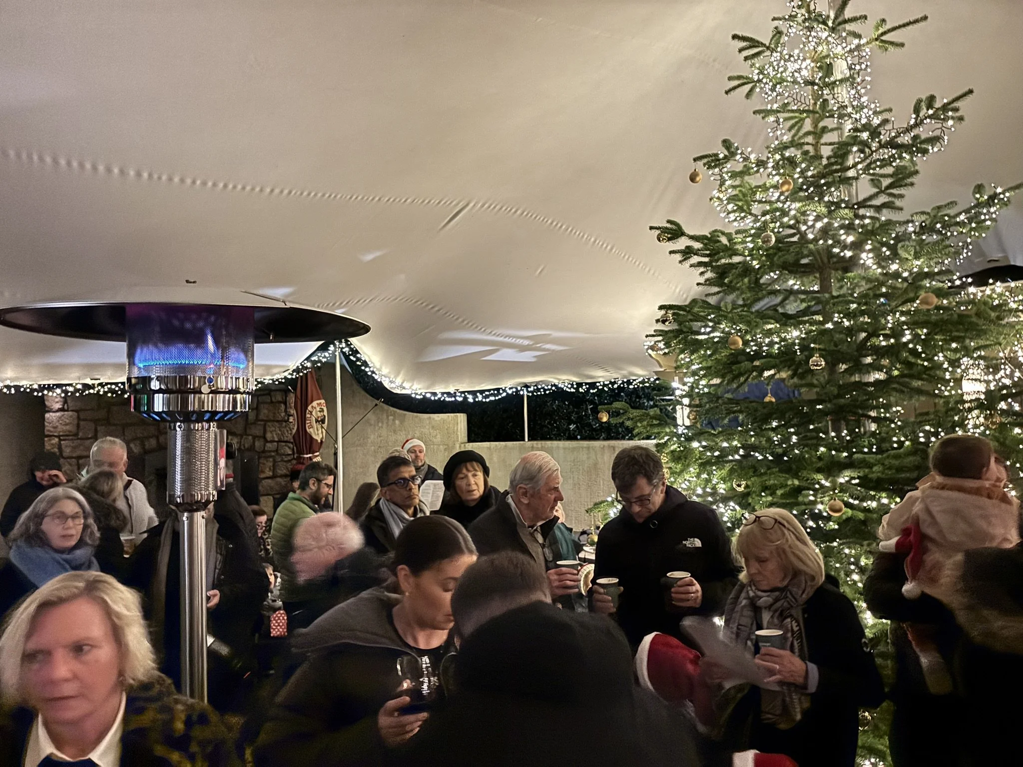 A festive crowd singing along! 