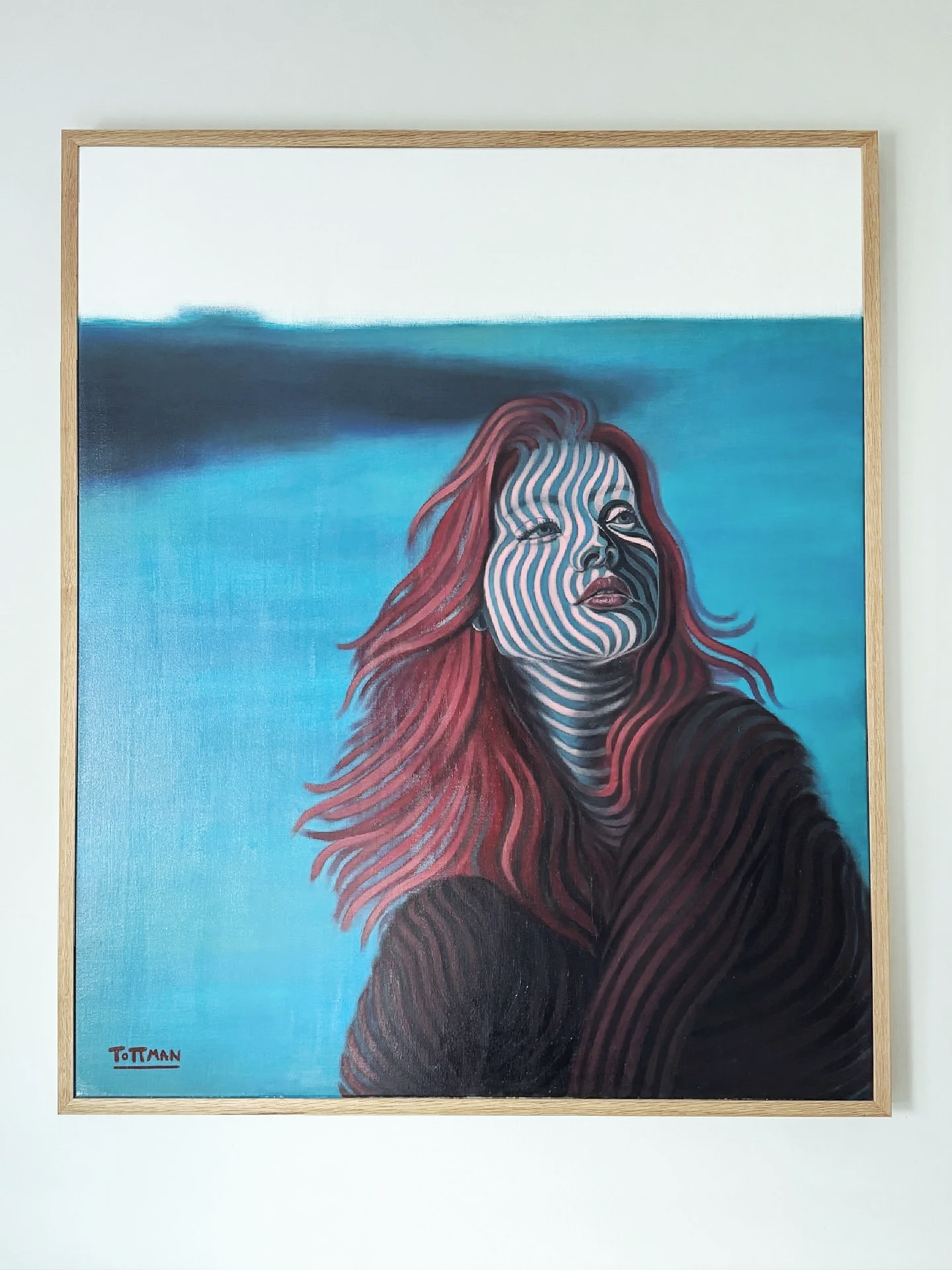 Painting of a woman with red hair and a striped pattern on her face, set against a blue background with a black shoulder and arm.