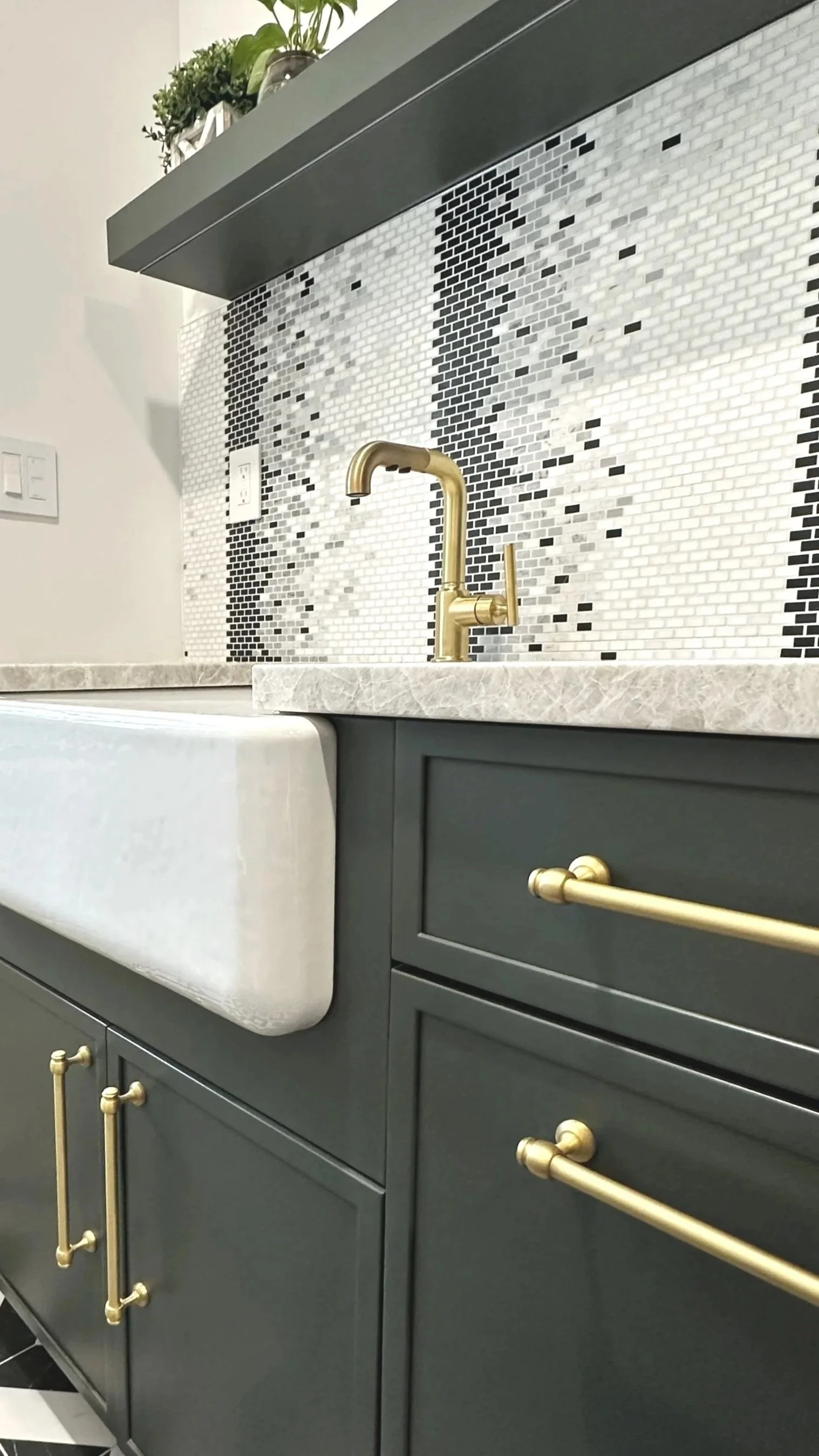 Sophisticated Foyer Featuring Matte Green Cabinetry