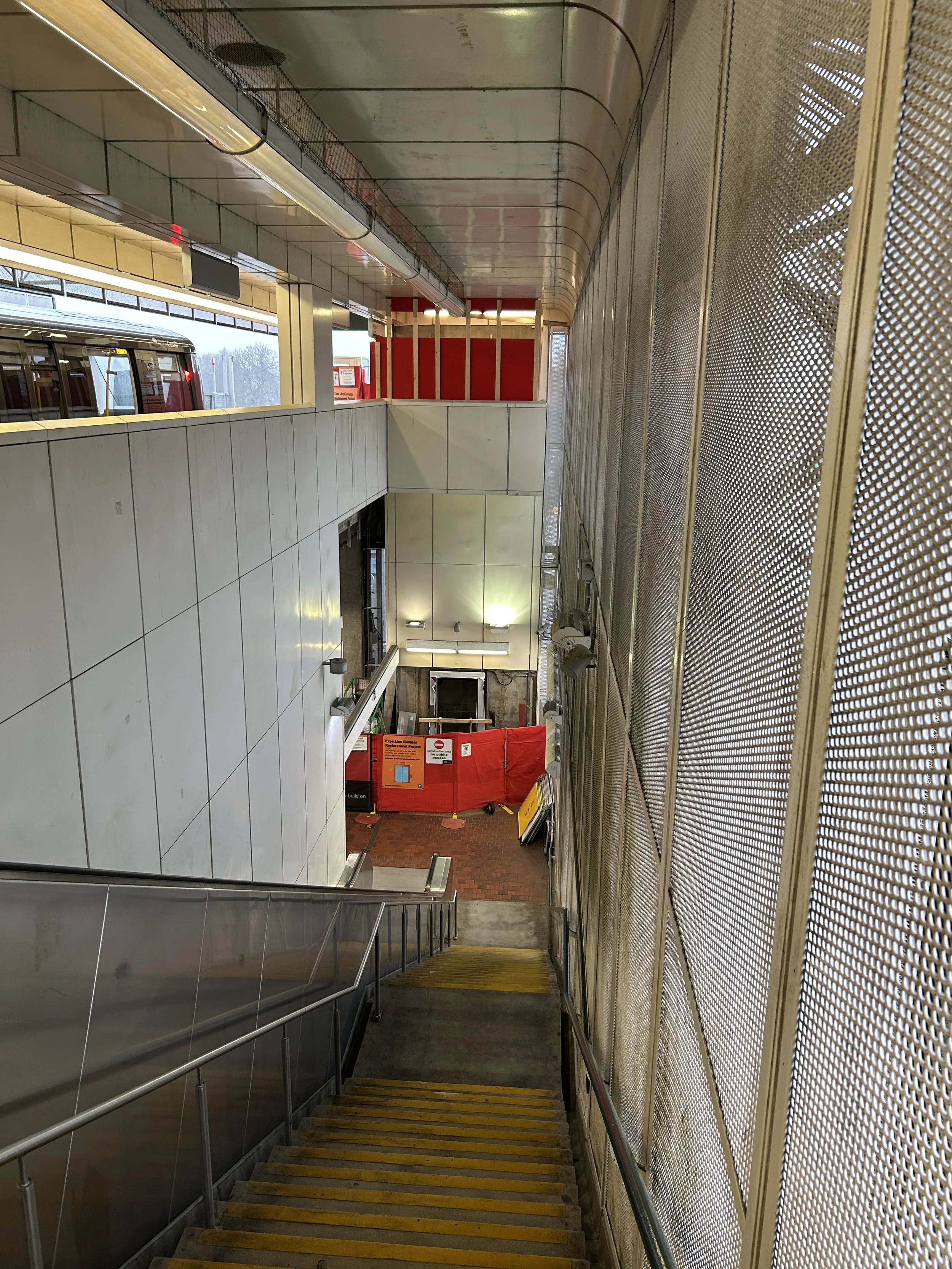 Maintenance bay with temporary hoardings and elevated service platforms during construction