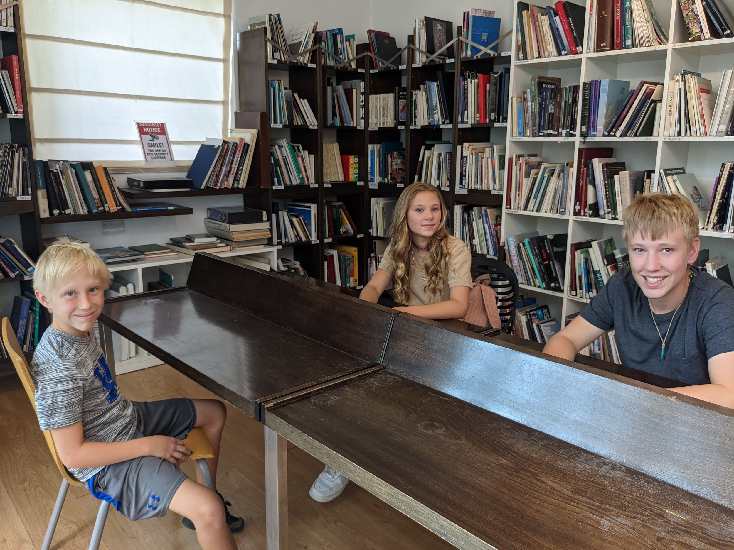 The kids relaxing in the library and cafe of the Jordan National Gallery of Fine Arts. Jabal al lweibdeh. Amman, Jordan