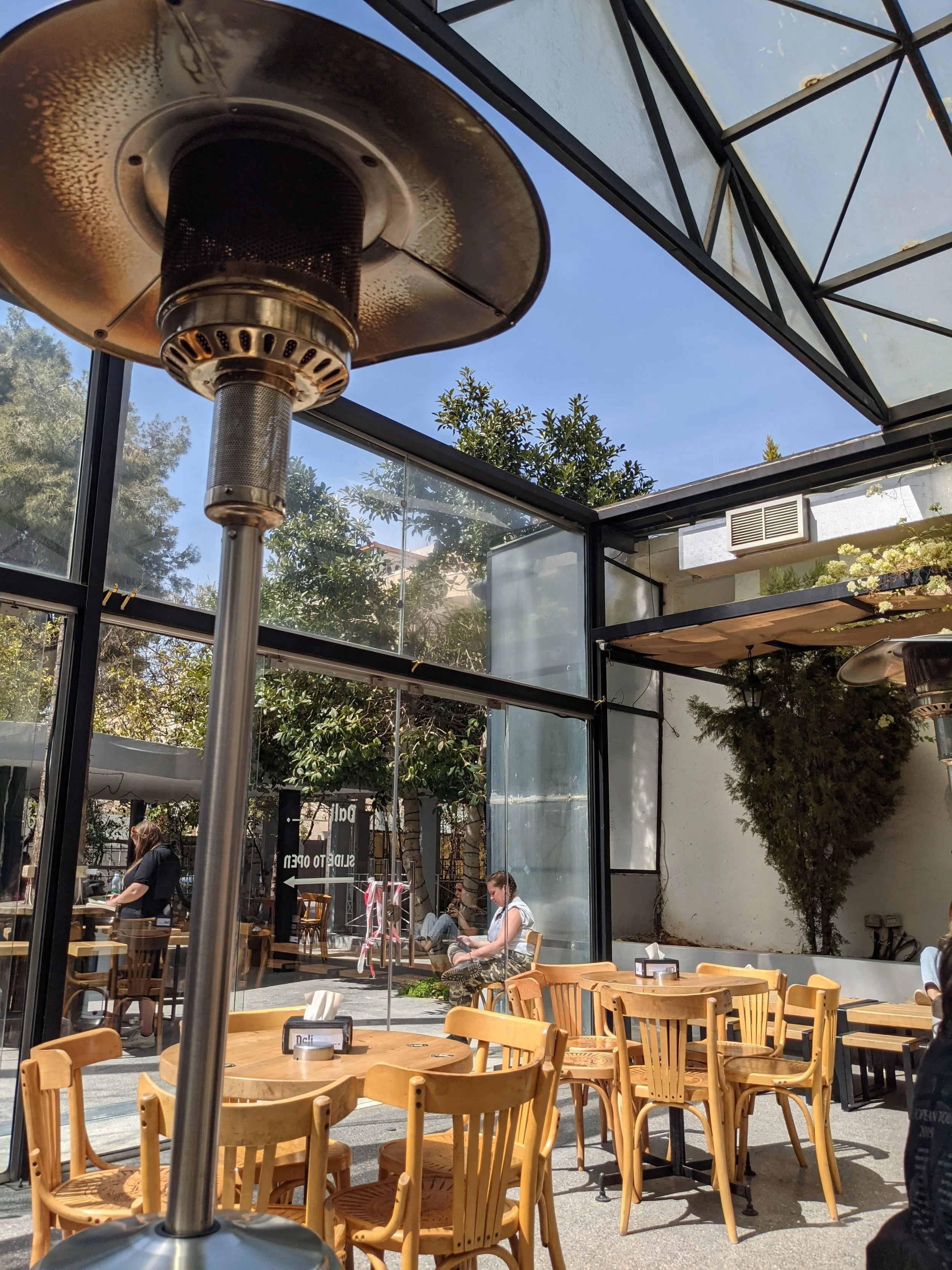 The Dali Space has indoor, outdoor, and hybrid seating, with food, draft beer, wine, cocktails, and Hookah