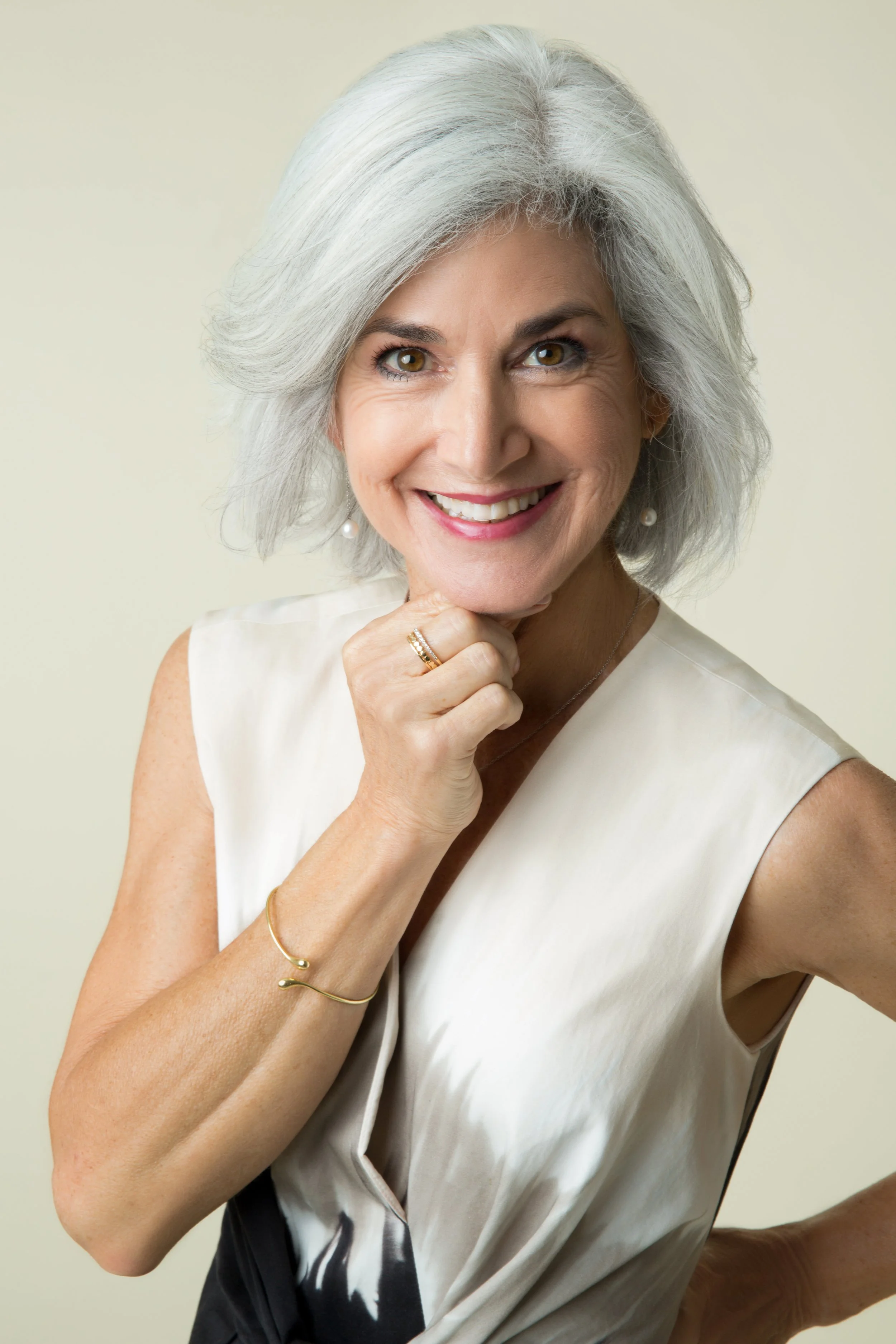 woman white hair cream dress