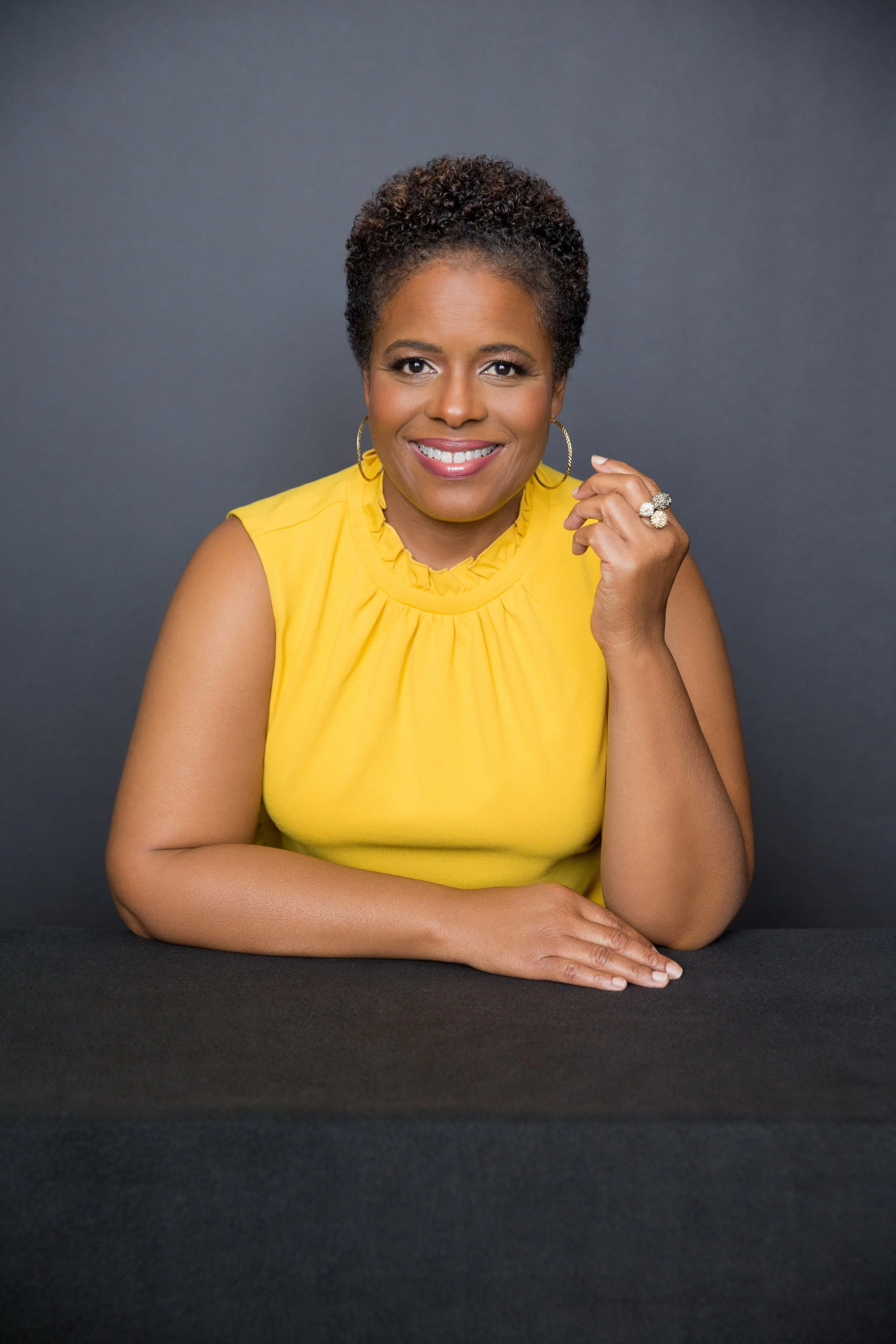 African American woman yellow shirt