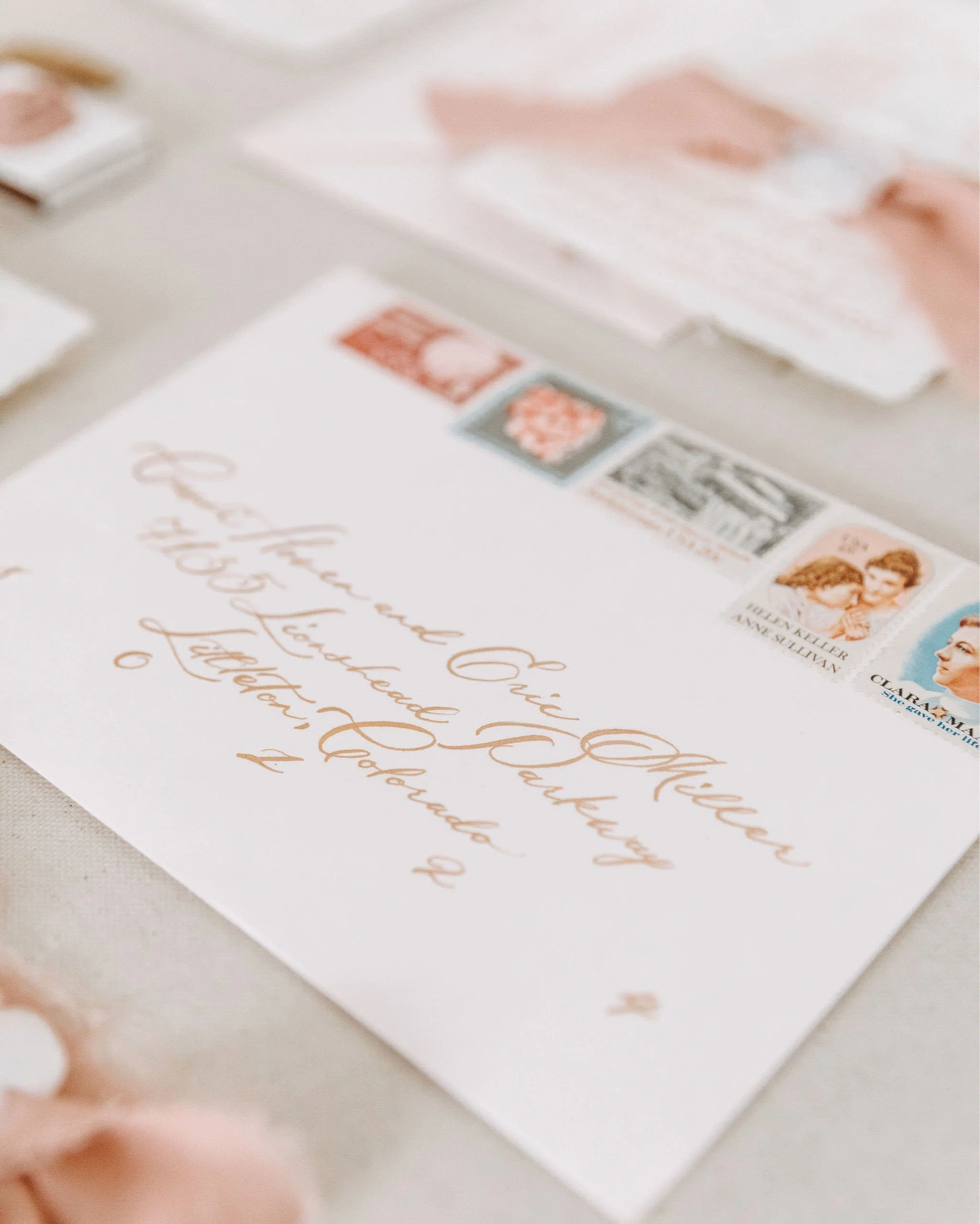 custom calligraphy in metallic gold calligraphy ink and custom vintage stamp curation