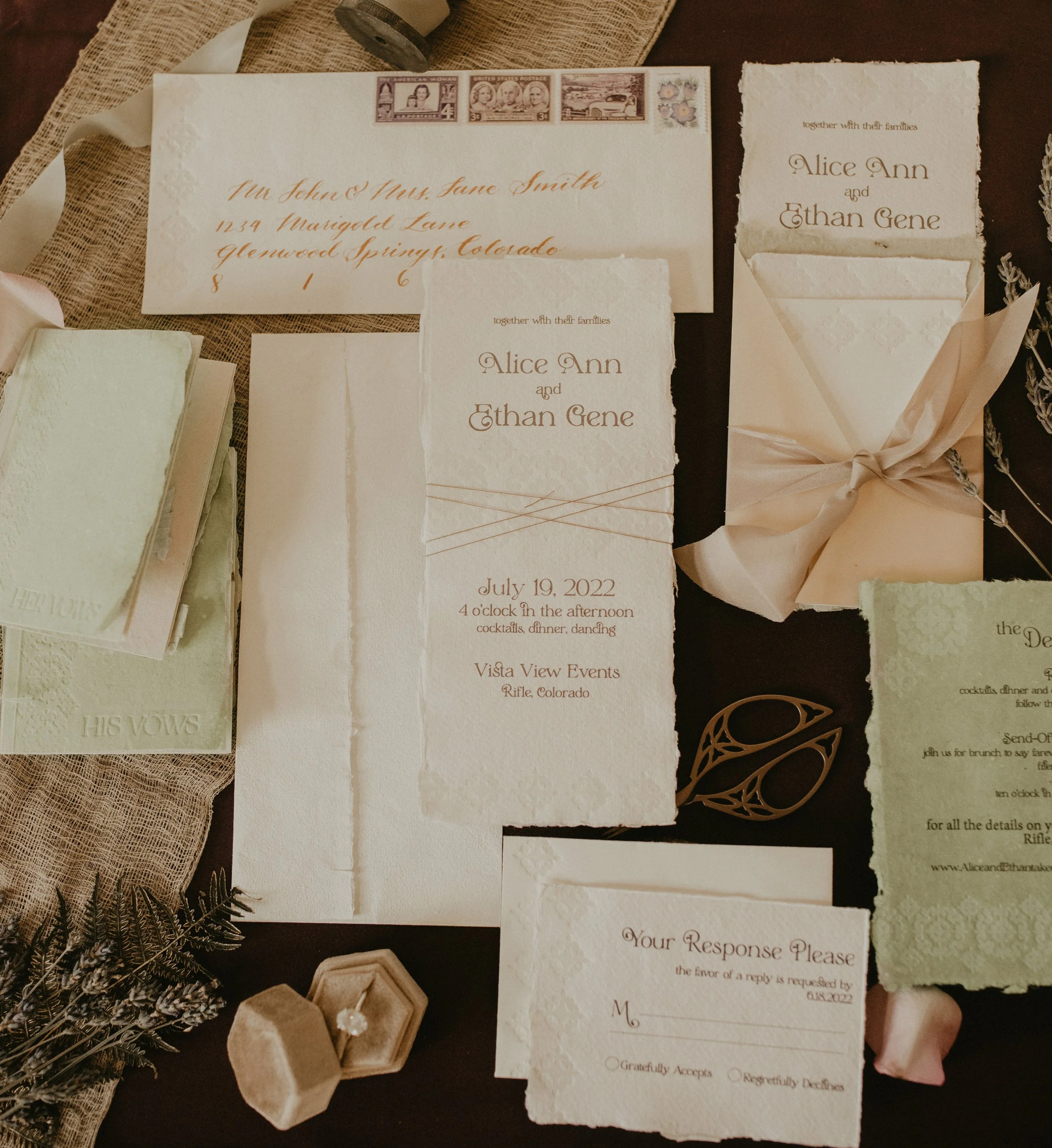 fully custom lavender and sage wedding stationery with hand made papers, hand dyed silk ribbon, vintage stamp curation and matching letterpress couples vow books