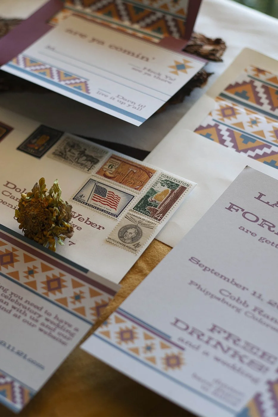 southwest jewel tone custom wedding invitations with vintage western stamp curation