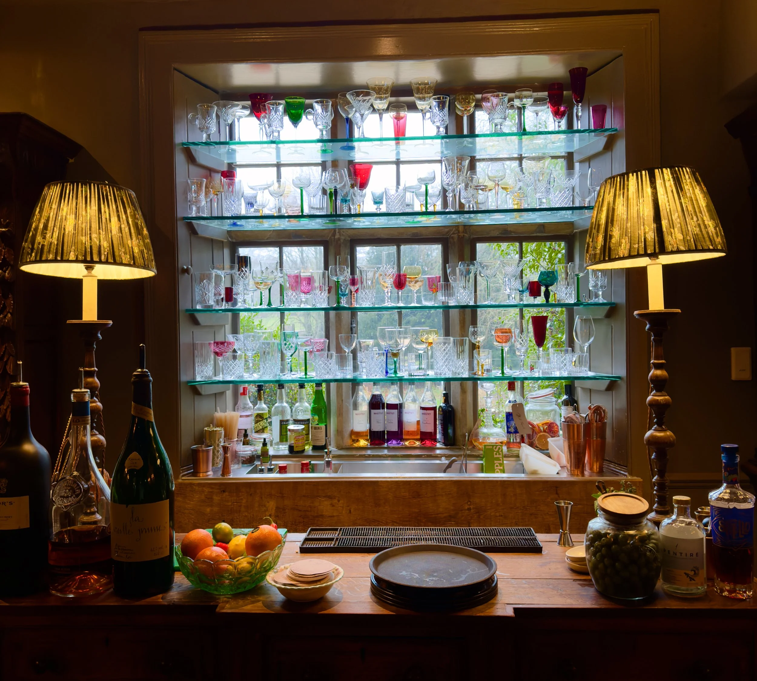 Coloured glass adorn most of The Pig’s cocktail salons Photo: AJT