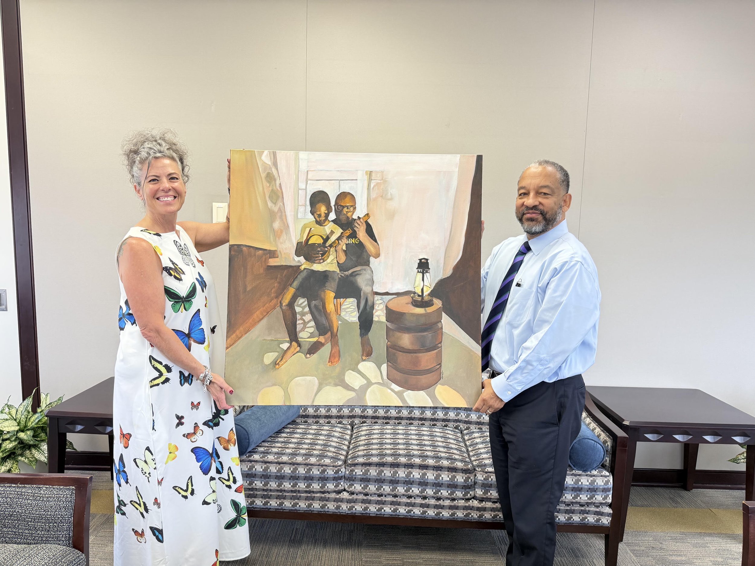 Wendy Hickey (ArtPop) with Charlotte Mayor Harrington, holding Goje by Dimeji Onafuwa