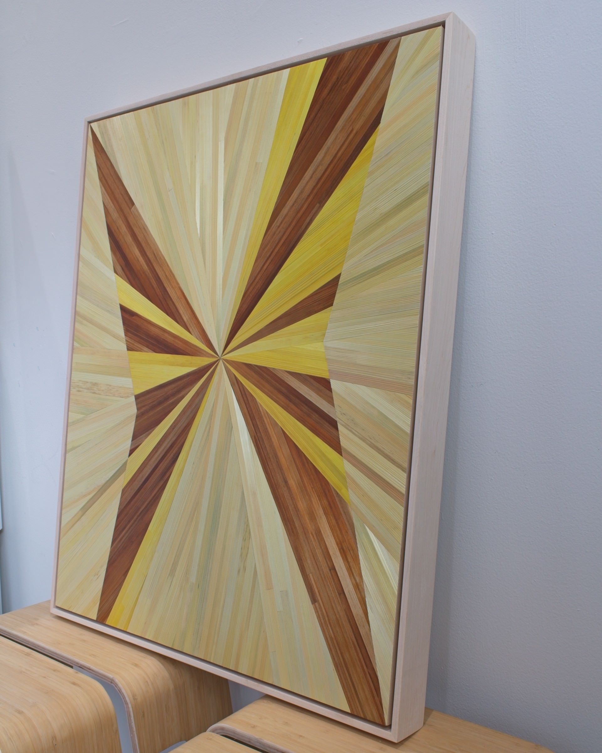 Side view of a maple float-framed straw marquetry panel showing frame depth — hand-dyed rye straw on wood, contemporary abstract wall art