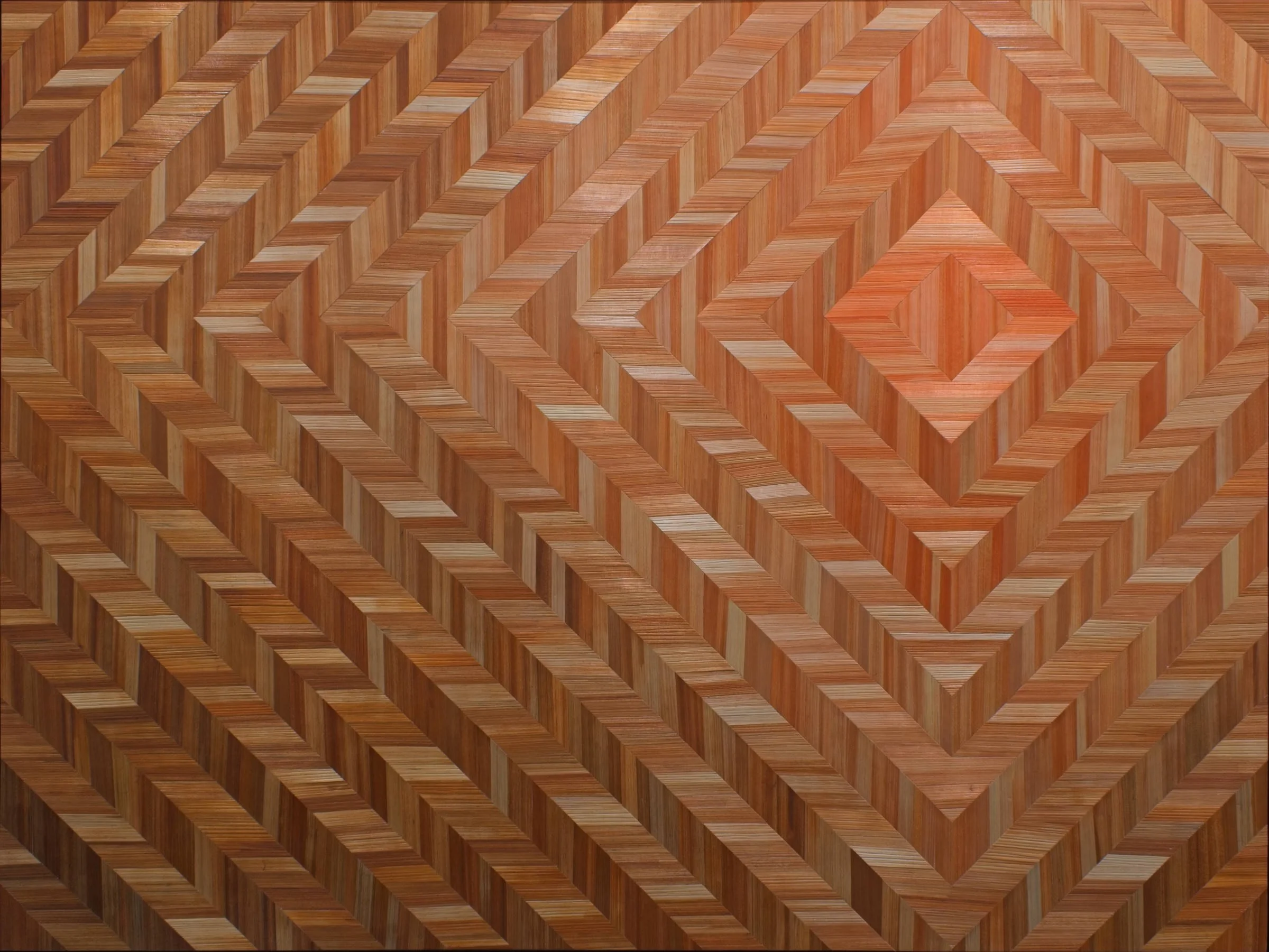 Hand-dyed straw marquetry panel with concentric diamond chevron pattern; gradient from coral center through rust and brown tones. 30 x 40in