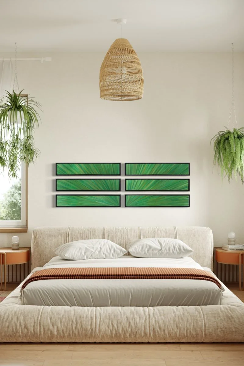 Hand-dyed rye straw marquetry panels forming a six-piece emerald green starburst grid, black float frames, shown in a bohemian bedroom installation — organic texture and fiber art craftsmanship for interior designers.