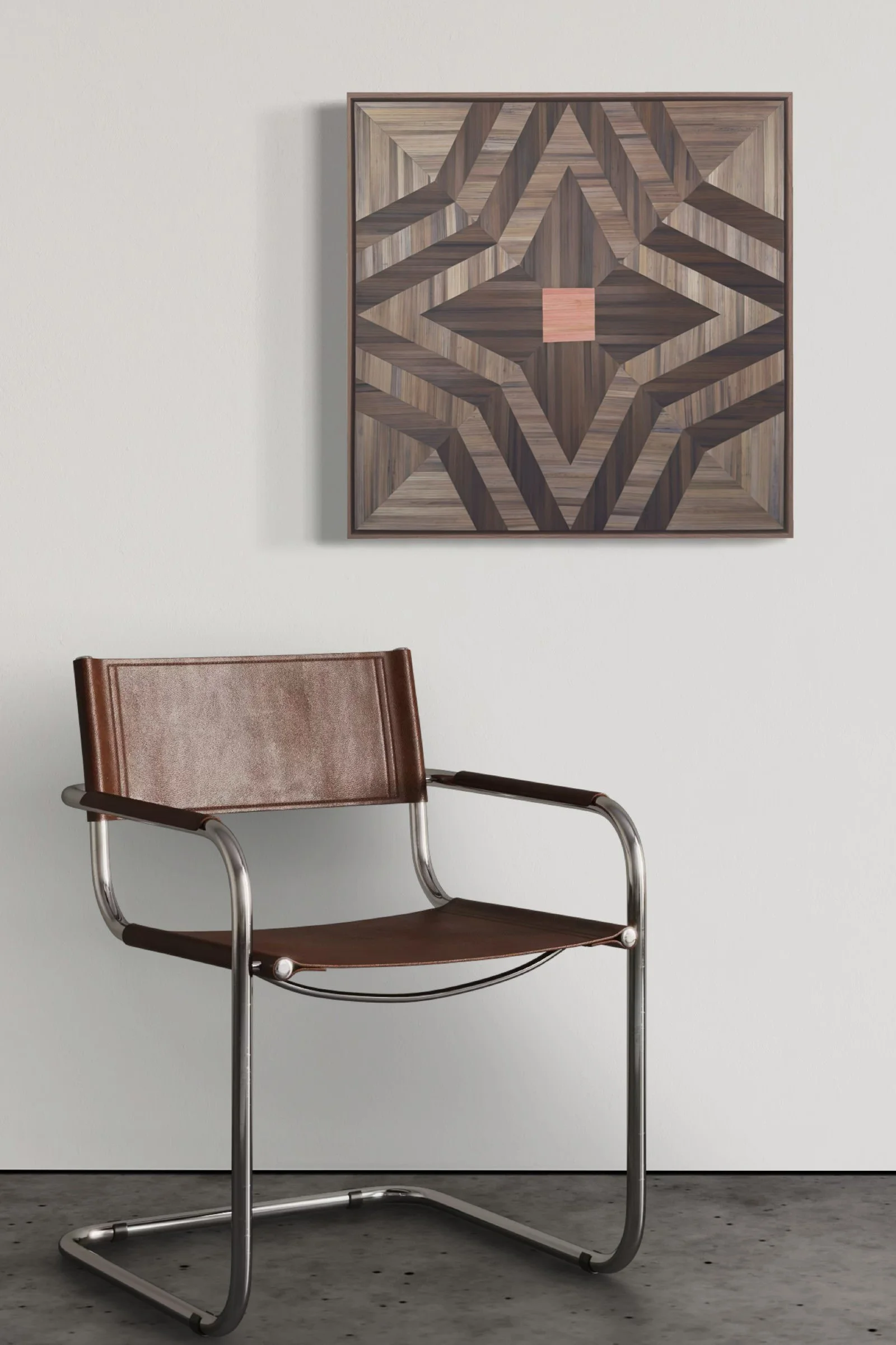 Guided Home abstract geometric straw marquetry fiber art on a white wall in a modern interior with natural light — organic textural wall art in pink and brown in a contemporary home setting