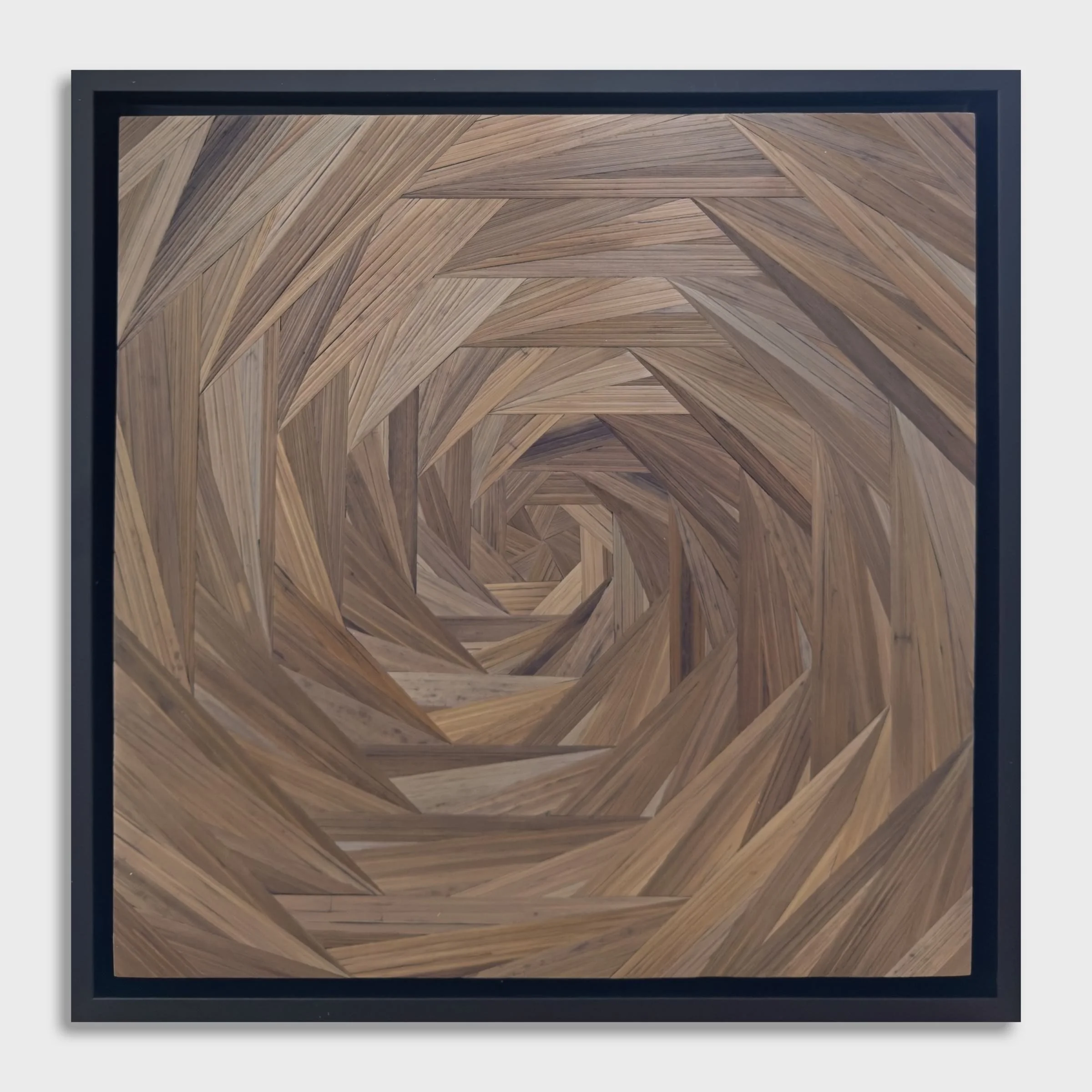 Straw marquetry wall panel, octagonal spiral composition in natural gray-brown rye straw on wood, in a black float frame, 12 × 12 inches