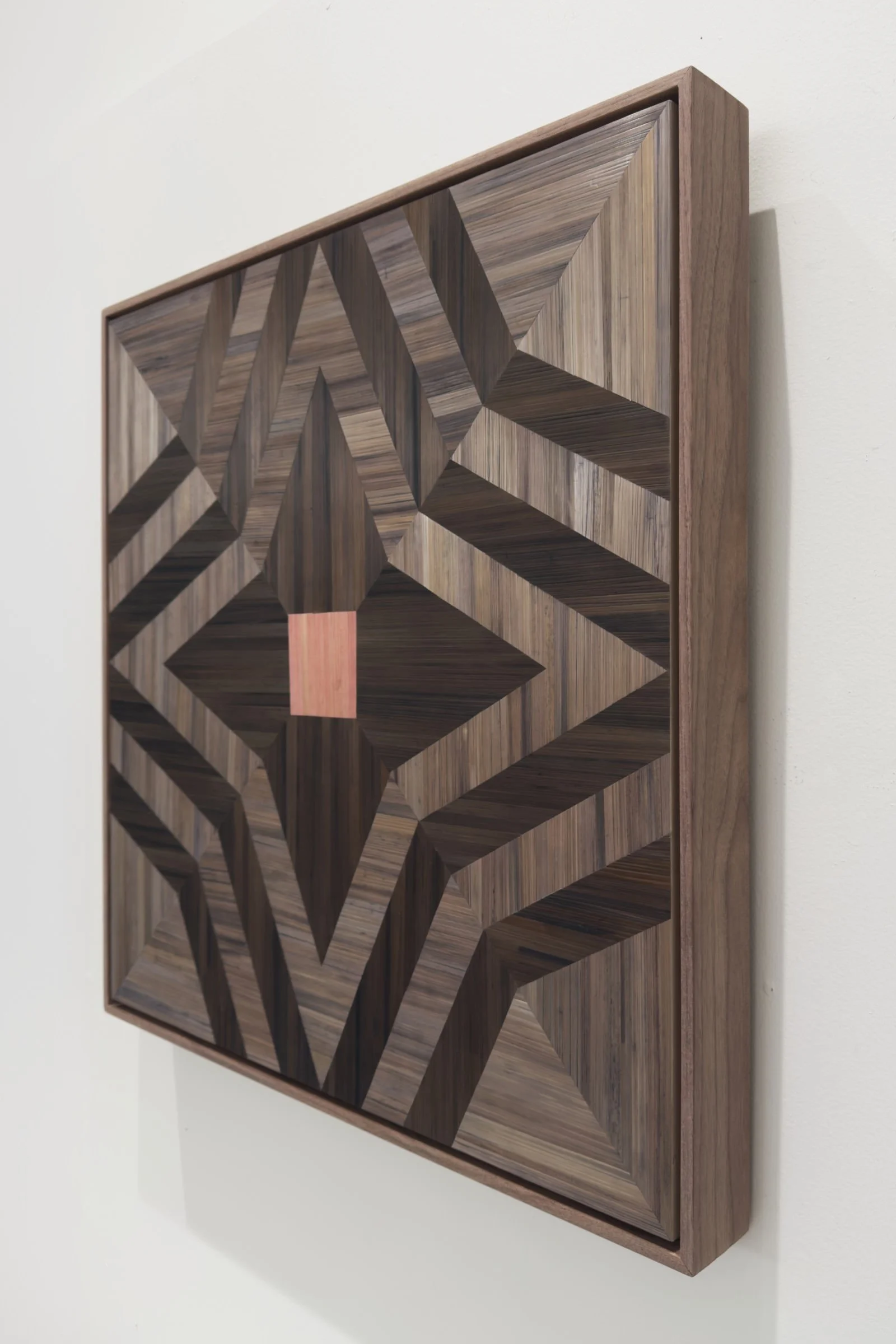 Side profile of Guided Home straw marquetry fiber art showing walnut float frame depth and straw surface luminosity
