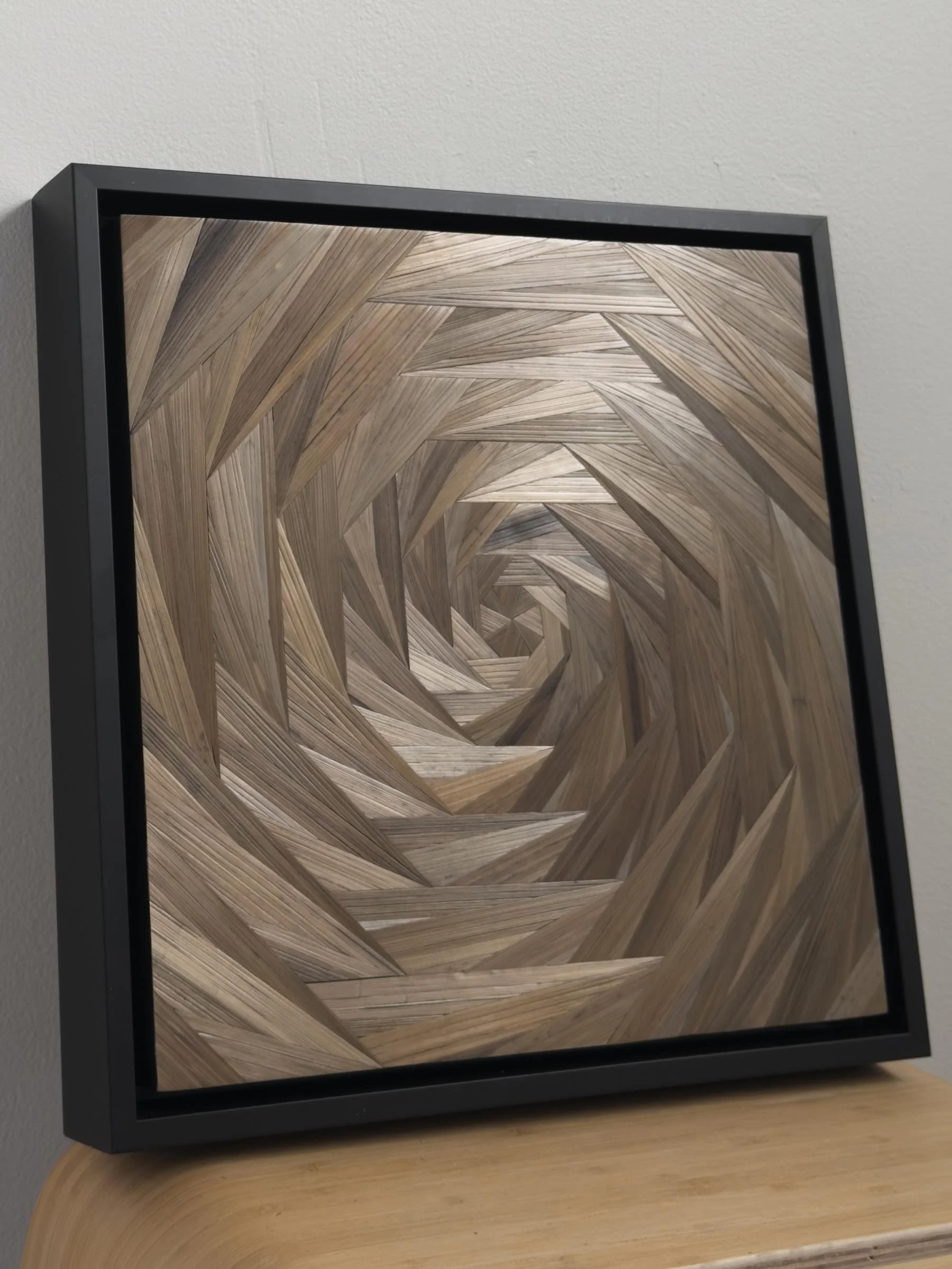 Side profile of What the Cabin Keeps 1 showing black float frame depth and luminosity of the straw marquetry surface