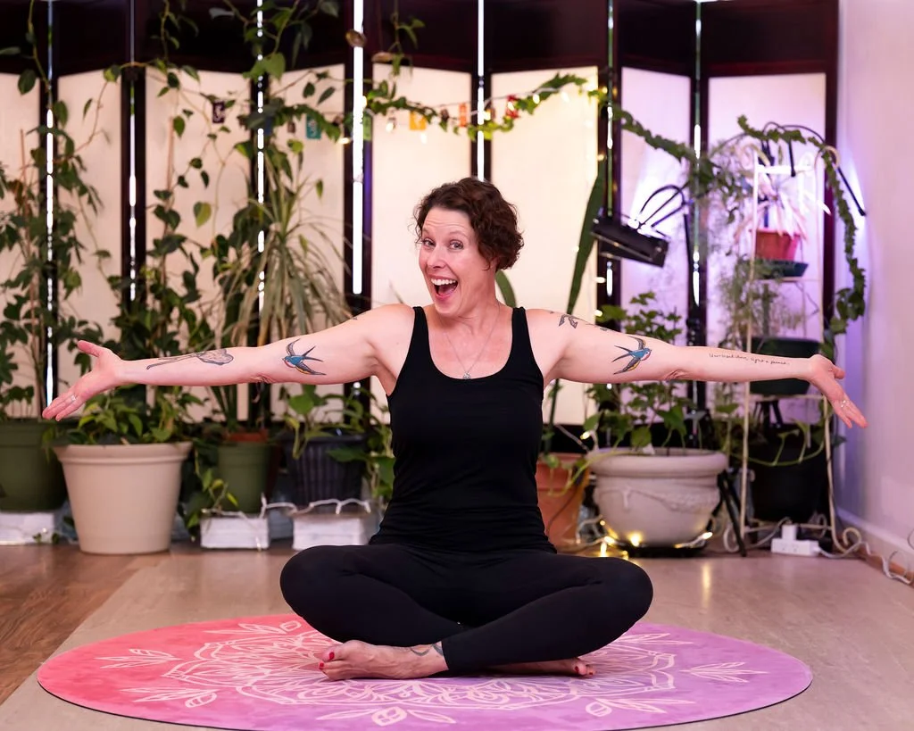 Dawn with arms outstretched smiling