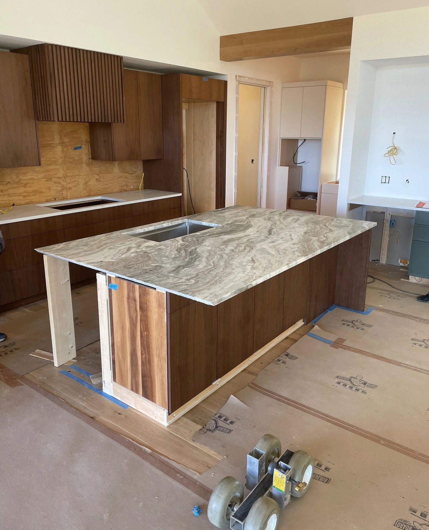We're excited for the installation of countertops from Burlington Marble &amp; Granite! The impressive 800 lb island counter is Fantasy Brown Granite. To get this hefty piece to the second floor, we needed to bring in a crane! The remaining counters 