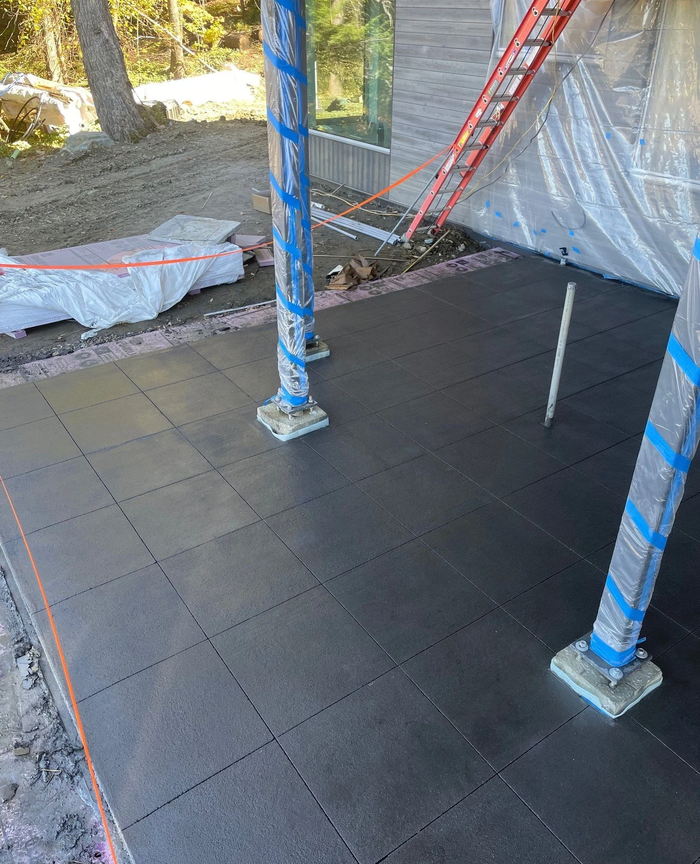 This stunning concrete patio at our new net-zero project in Waitsfield features a beautiful pattern achieved through saw cuts. This work was crafted by Megan Moffroid from Broadleaf Landscape Architecture, while Haskin &amp; Associates in Waterbury h