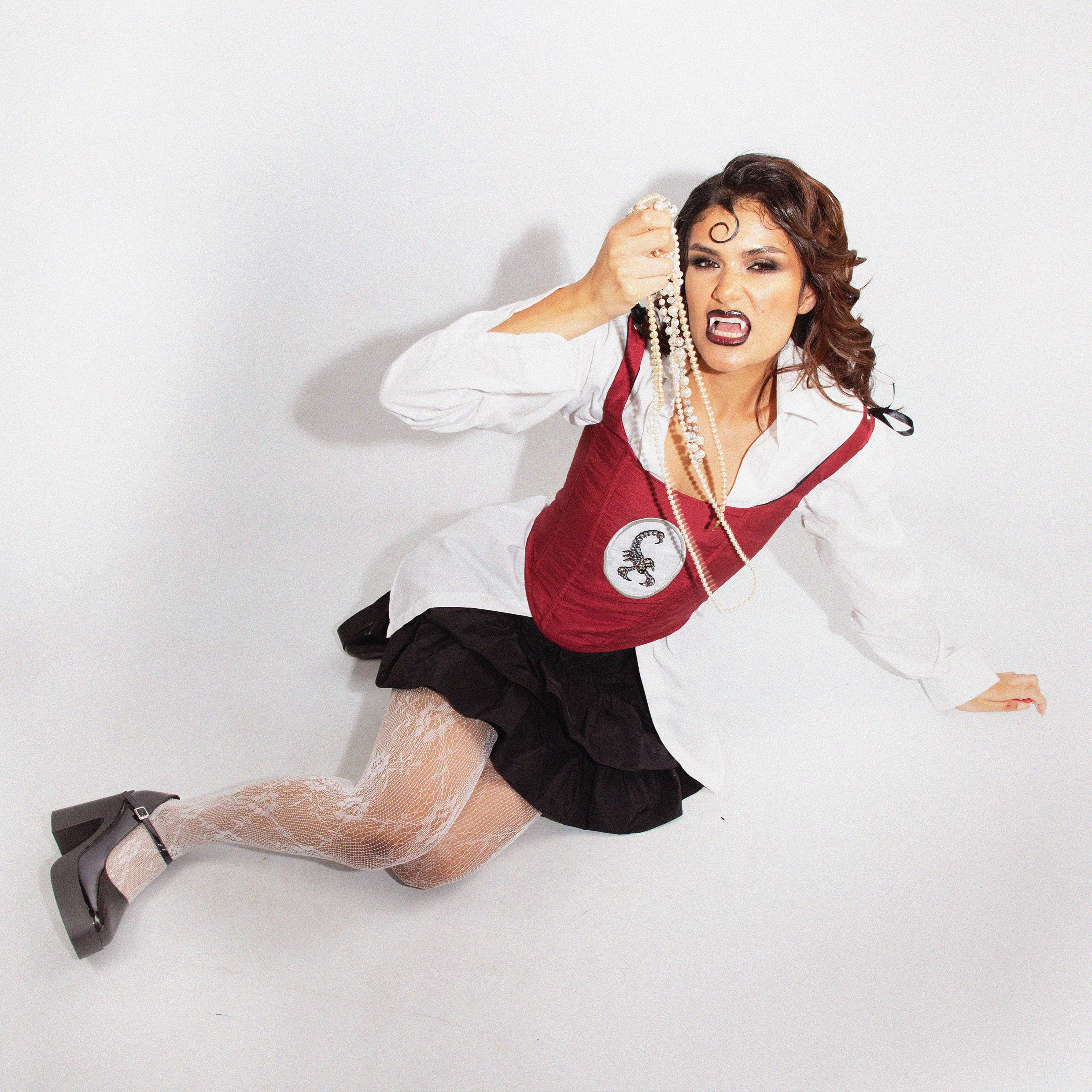 mohini in red corset with socrpion.jpg