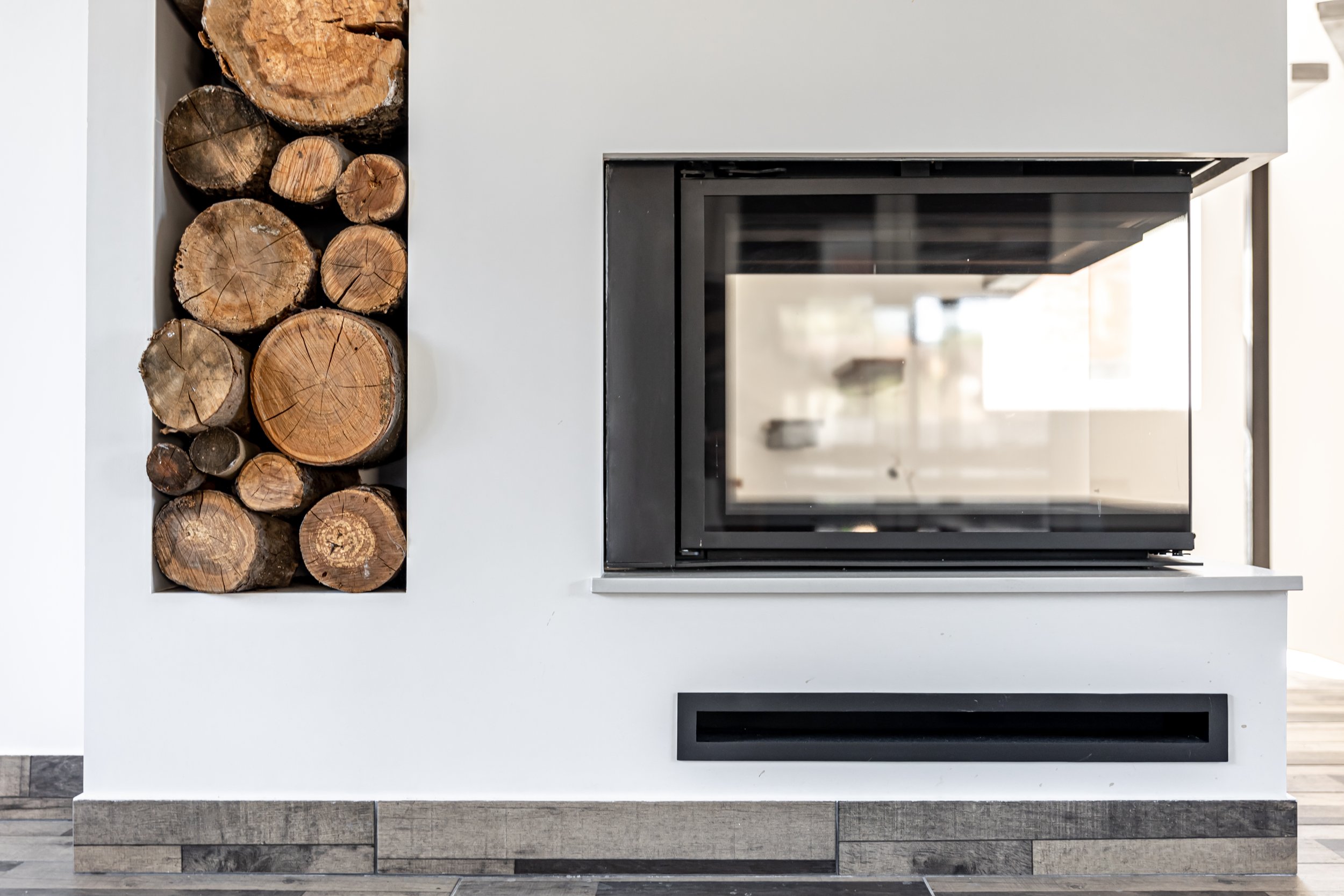 Custom-built modern fireplace addition to the outside patio.