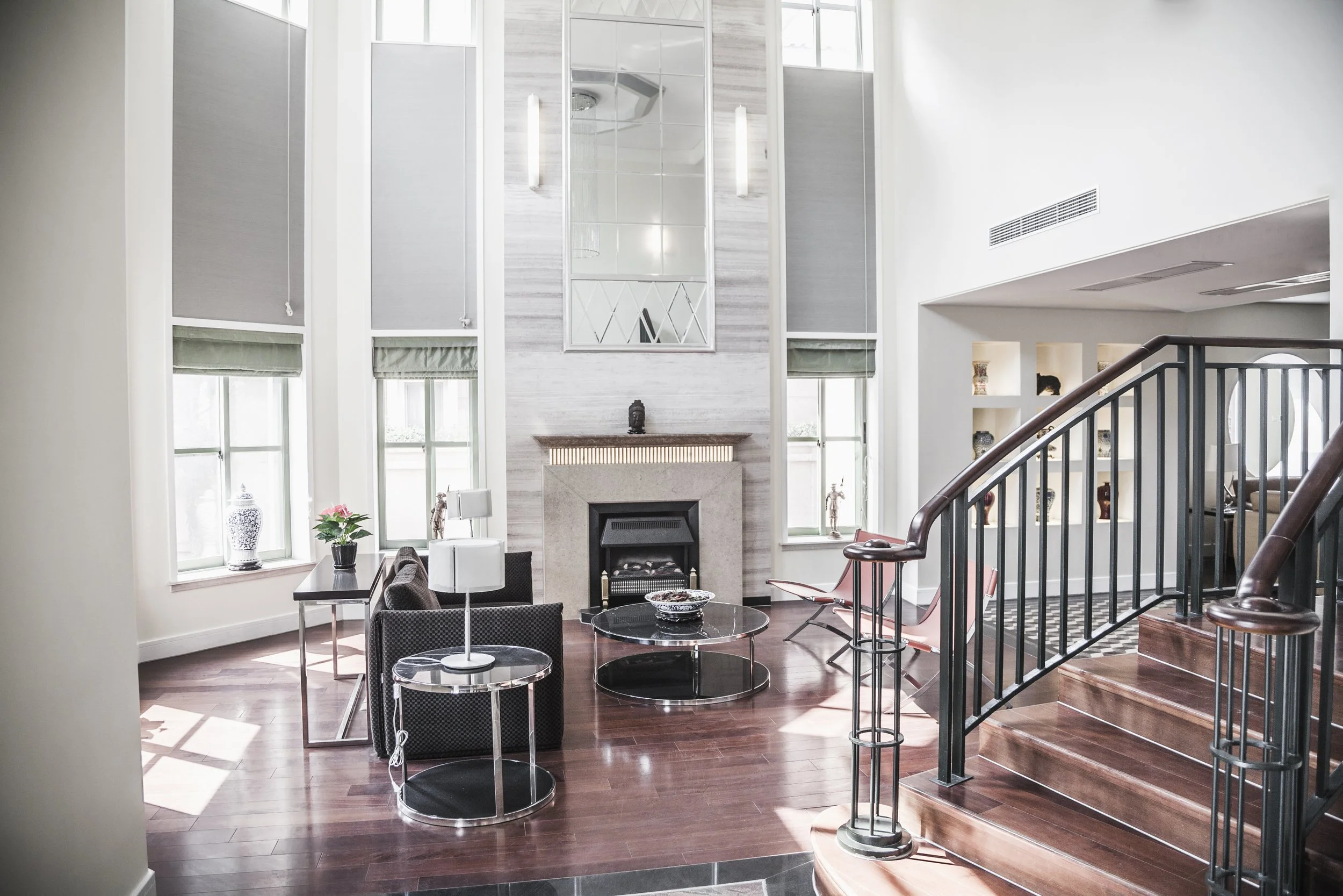 Modern home entryway with vaulted ceiling and natural lighting.