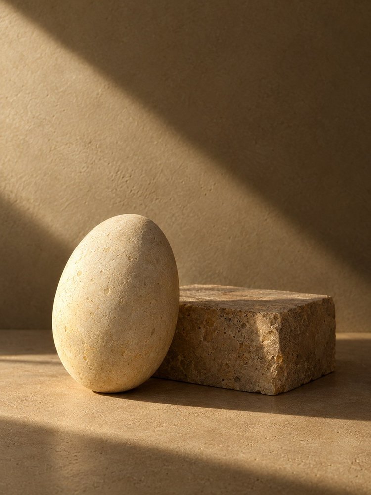 Smooth sculptural stone in warm angled sunlight.