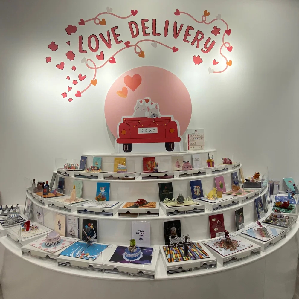 Love Delivery mural and cards at the Lovepop store.