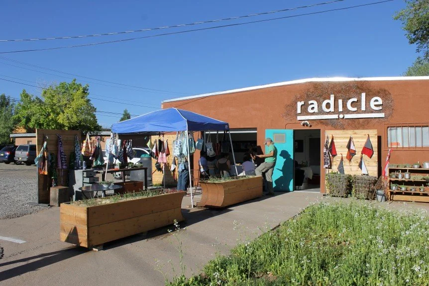 Summer evening event. Cover crop in living canvas garden in front of radicle.