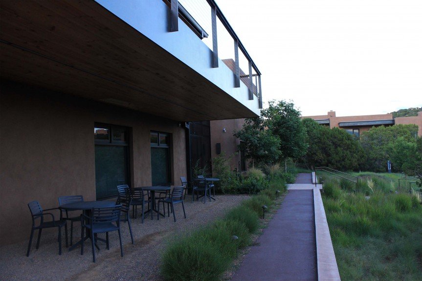 Front entrance outdoor meeting area. Moonlight Broom shrub species grace walkway.