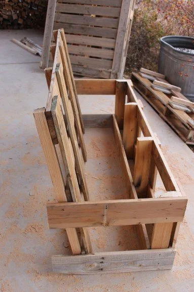 Pallets deconstructed and reassembled as bench infrastructure.