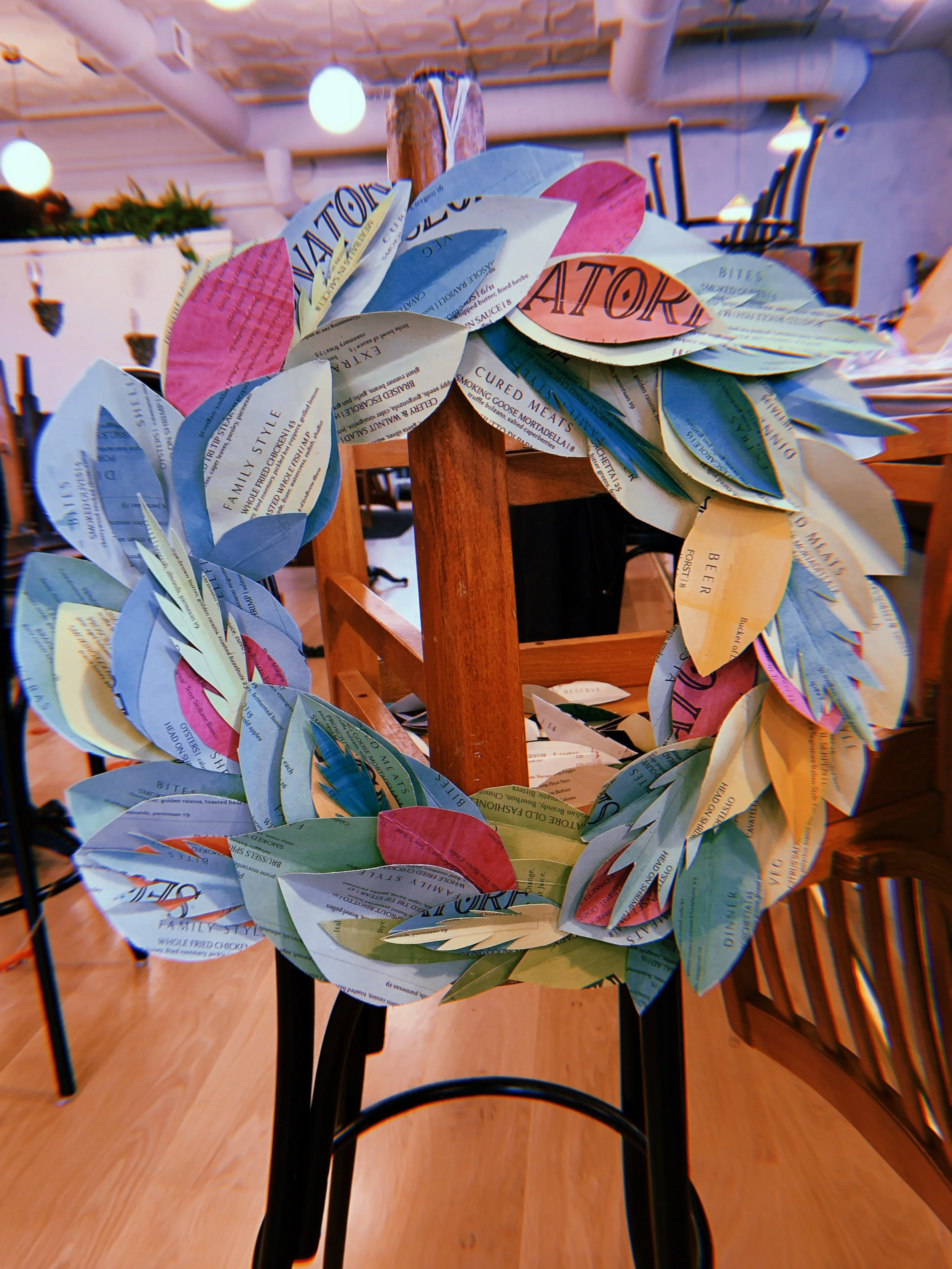 Christmas install at Segnatore: Repurposed old menus by dyeing them and creating sustainable wreaths.