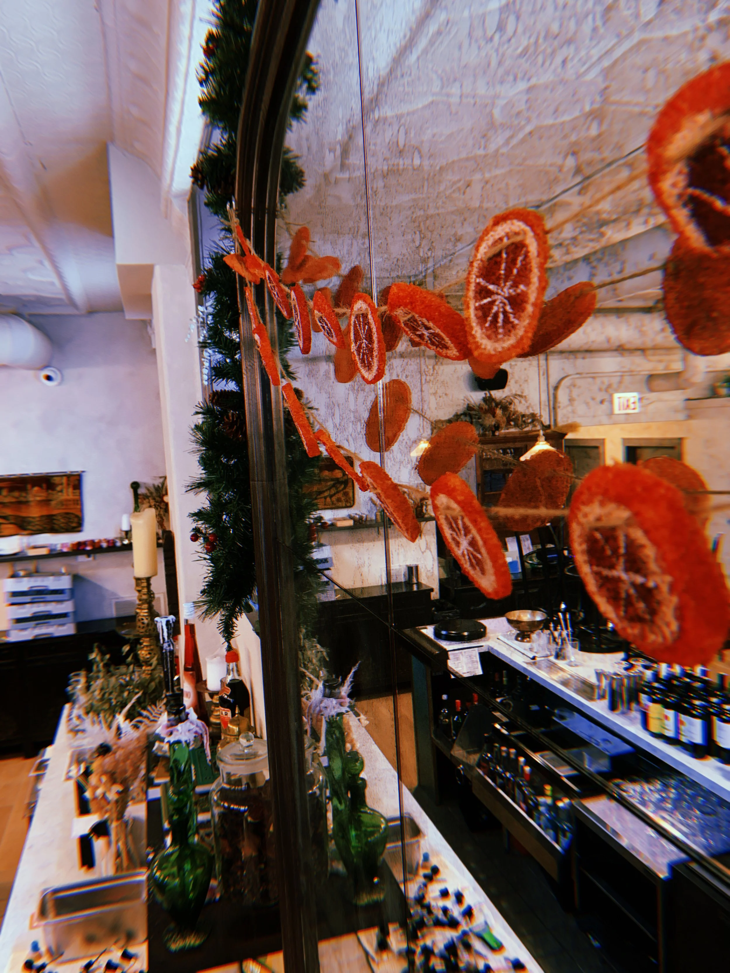 Christmas install at Segnatore: fabricated dried orange garland out of styrofoam balls 