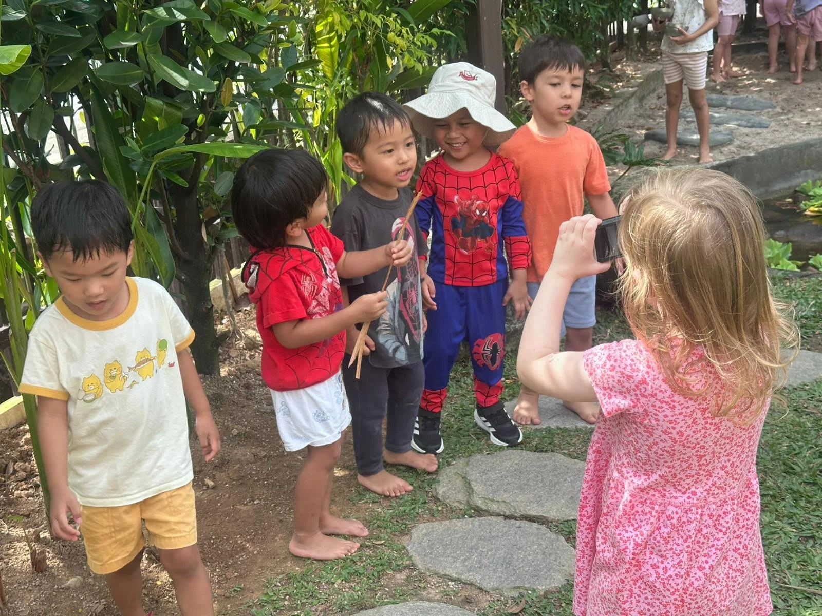 Nurtured Nest children taking photo