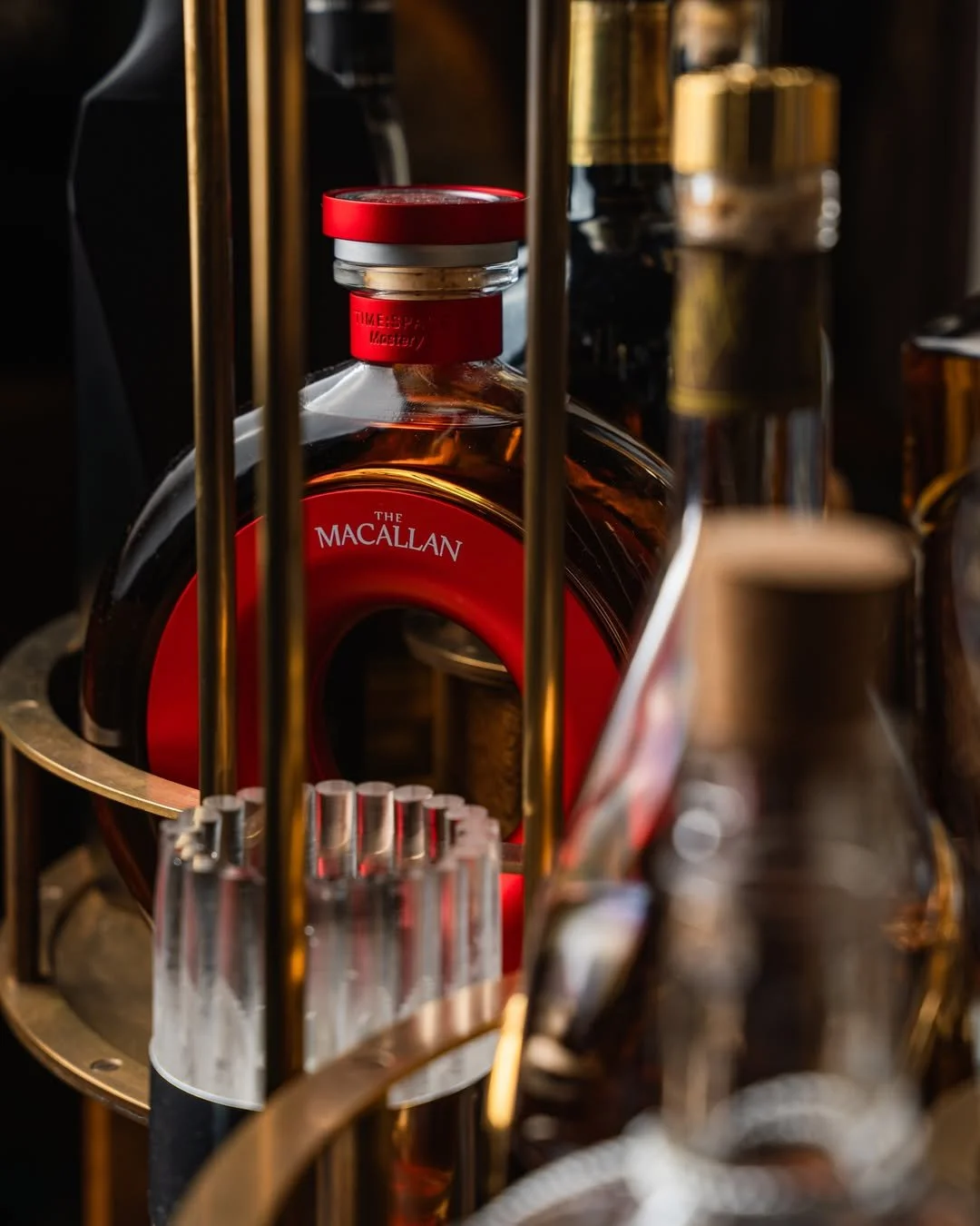 The warm, golden tones of our brass bottle carousels, highlighting the spirits on display in the bespoke digestif trolley we designed and created for the team at Row on 45 ✨ 

📸 @rowon45dubai