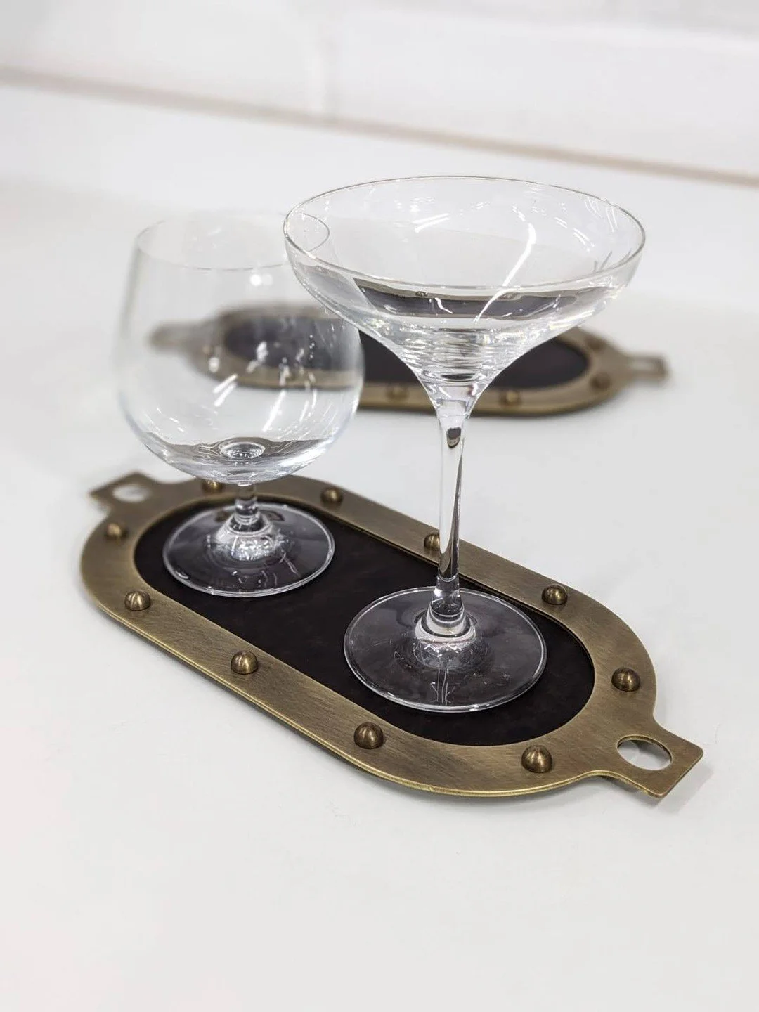 Working on something new in the @rewthink workshop! ✨ 

Small drinks trays crafted from antiqued brass and a durable paper composite for a modern, tactile finish. The trays self-align when nested to create a stable, space-saving stack for seamless st