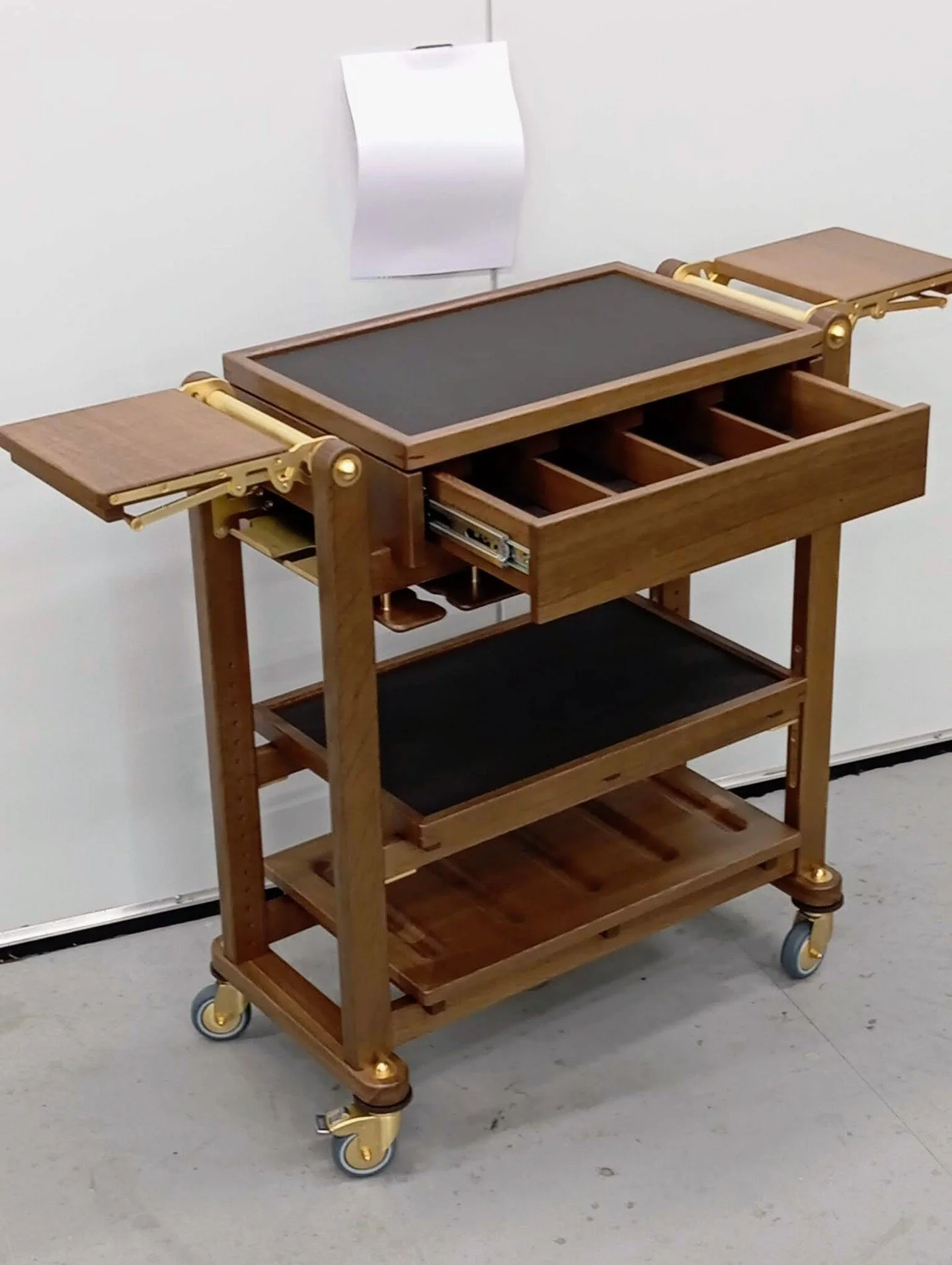 A bespoke @rewthink wine trolley, engineered for seamless service ✨

Featuring folding serving arms and a dedicated drawer for essential tools, it also houses a menu holder, integrated glass storage, and carved wells to keep wine bottles safely cradl