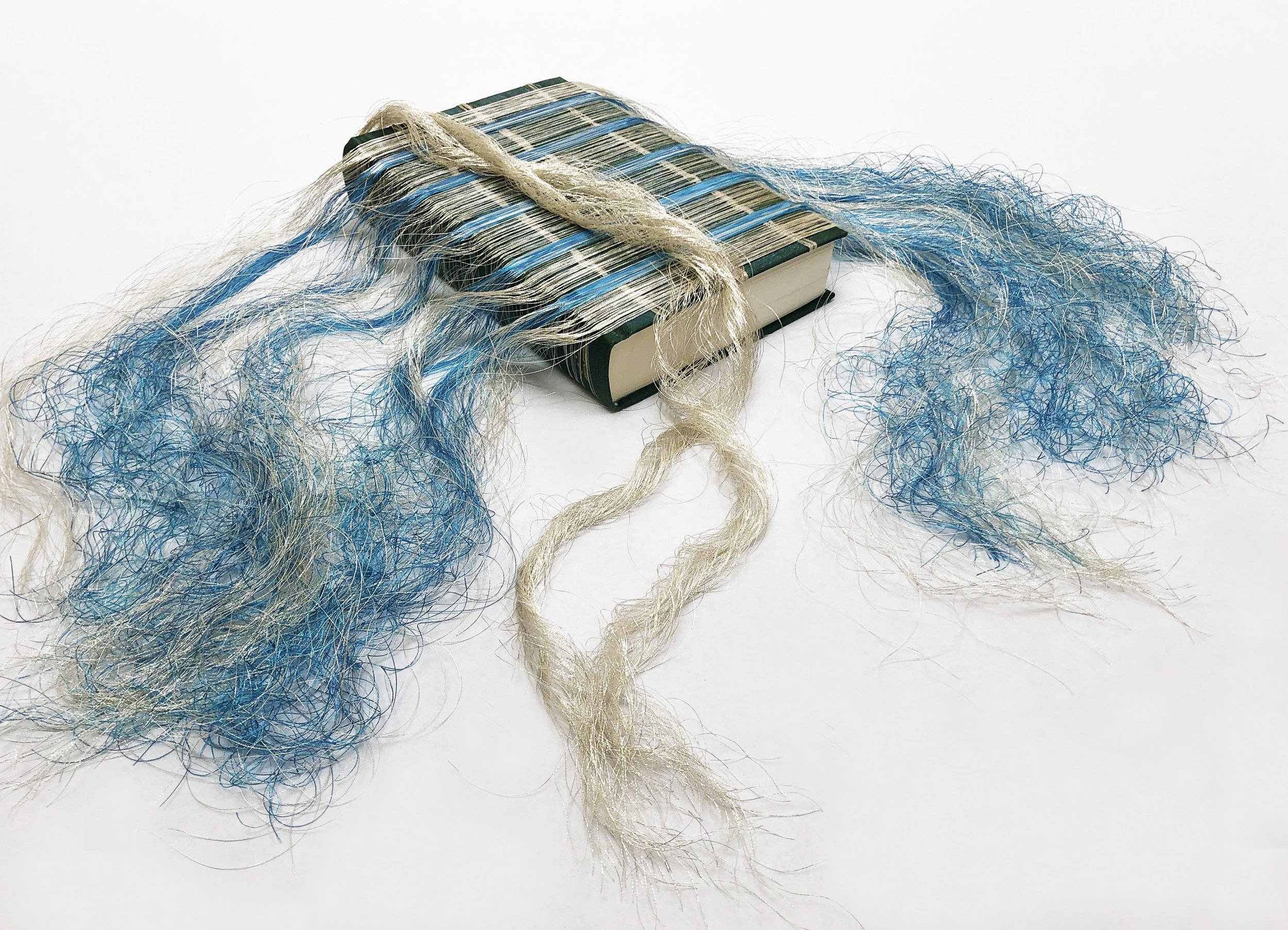 Linda Ekstrom . Mr. Emerson 2022 . Altered book, thread, book binding glue . Approximately 20" x 8" x 1.75" . $900