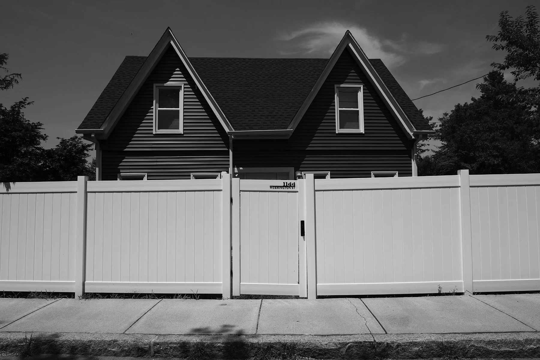 Lee Nadel . House with White Fence 2024 . Infrared photograph, archival pigment print . 12" x 18"
