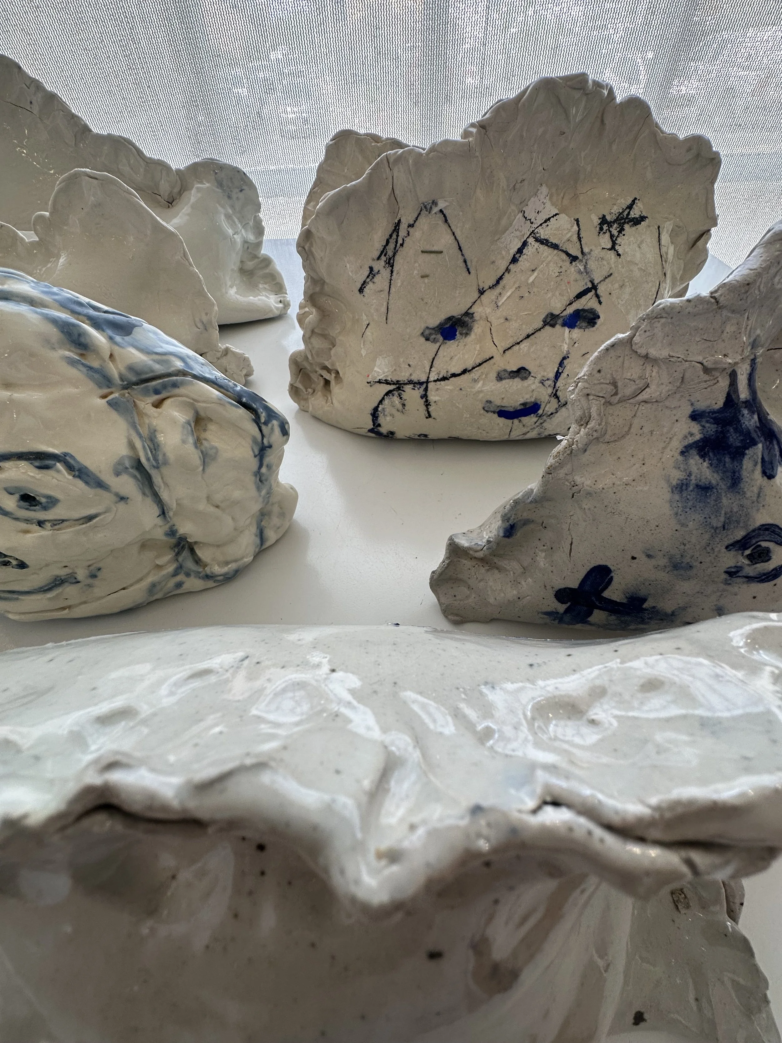 Mark Cooper . from the series Nu Blue Dumplings 2026 . Ceramic, glaze . dimensions variable
